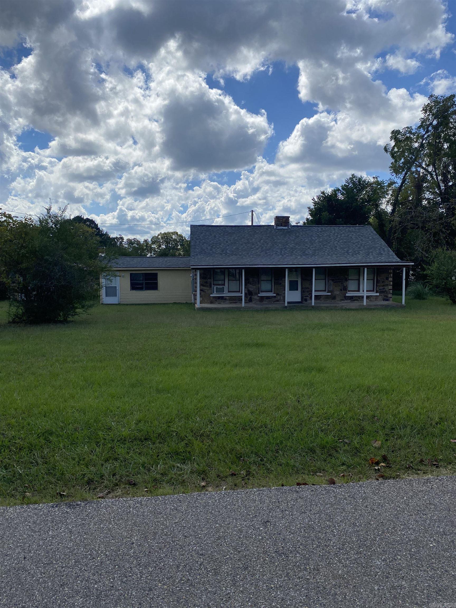 Step into this beautiful remodeled rock home on the outskirts of Mena with a country feel.This 3 bedroom, 2 bath home features a large bonus room downstairs and a loft upstairs. Outside thereās a detached 1 car garage with a concrete floor that could be used as a hobby room. Kick back on the generous front porch at the end of the day!