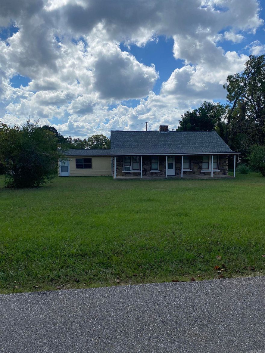 Step into this beautiful remodeled rock  home on the outskirts of Mena with a country feel.This 3 bedroom, 2 bath home features a large bonus room downstairs and a loft upstairs. Outside there’s a detached 1 car garage with a concrete floor that could be used as a hobby room. Kick back on the generous front porch at the end of the day!