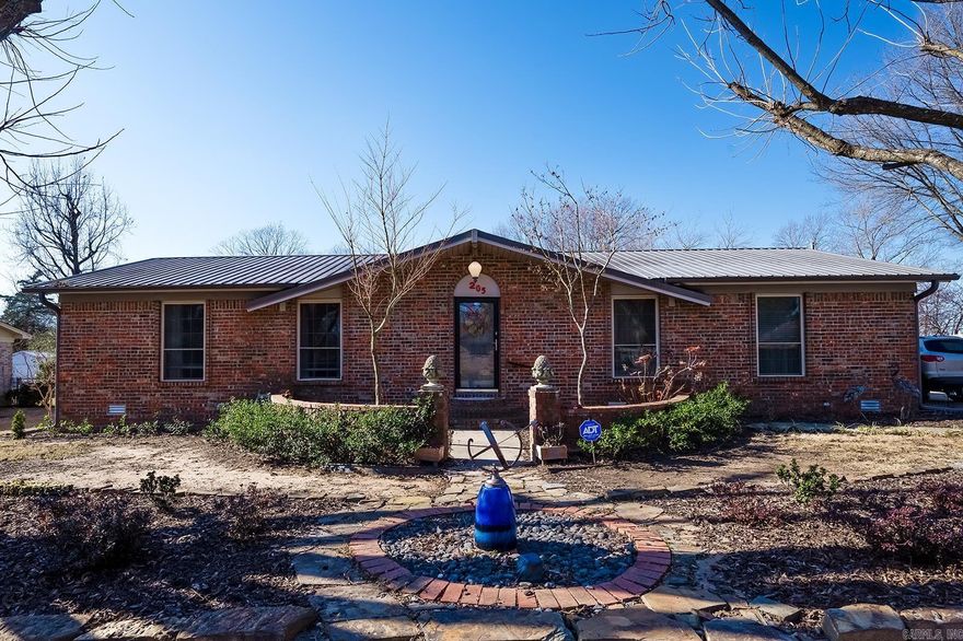 This house nestled on two lots in the heart of Beebe, would provide the convenience of being close to shopping and schools, while still having space to garden with the many raised beds with irrigation and greenhouse for growing.  Also, a 10x12 Garden Shed with room to park lawn mower behind. Rain barrel irrigation for raised beds.  The Large 16x32 Shop with "His work space" and "Her storage area" with a mini-split to keep you cool or warm.  Optional 3rd bedroom that is currently being used as a large utility room.  Spacious, screened in back porch with above head storage.  Large kitchen island with storage, walk-in pantry and pantry for small appliances as well. His and Hers walk-in closets in the MBR.  LVP flooring throughout.  Majority of the furnishings and many of the tools can be sold with a Bill Of Sale.  Metal Roof is less than 10 years old.  Water Heater is less than 3 years old. HVAC replaced in 2015.  Refrigerator conveys.  **The crawl space is completely encapsulated and has a sump pump.