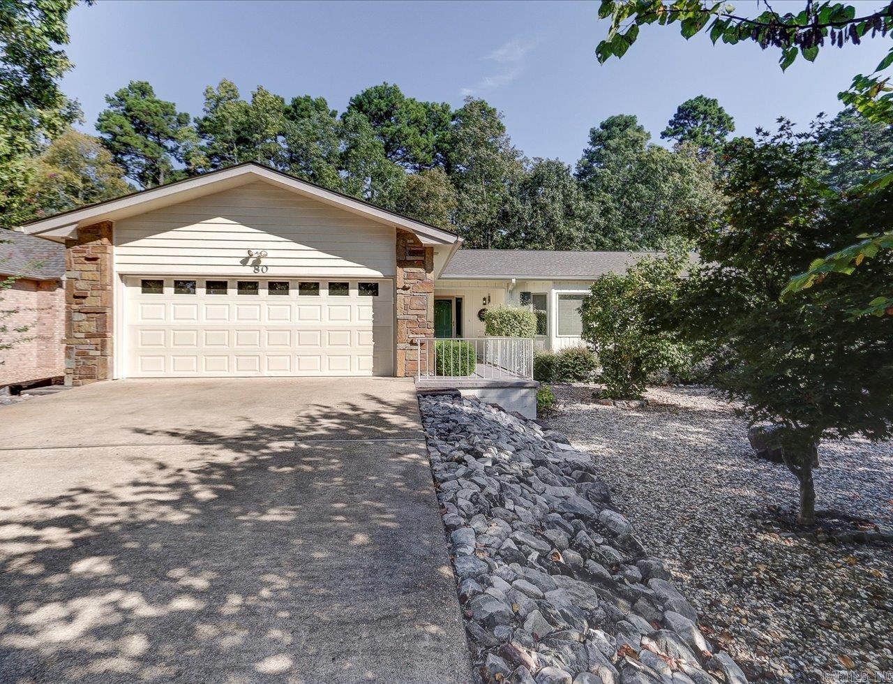 Stylishly Renovated Ranch Home in Hot Springs Village Welcome to this beautifully updated one-level ranch-style residence nestled within the secure, gated community of Hot Springs Village. Renovated in 2024, this move-in-ready home boasts exceptional curb appeal with manicured landscaping and a thoughtfully designed interior. Key Features: *Modern 2024 renovations: wood flooring, sleek kitchen, and updated bathrooms *Spacious open-concept layout ideal for everyday living and entertaining *Bright screened-in sunroom/Arkansas Room with skylights and scenic views *Outdoor deck perfect for relaxing or hosting guests *Cozy breakfast room and dedicated laundry area *Elegant primary suite with trayed ceiling and walk-in closet *Professionally low maintenance landscaped exterior for year-round beauty Community Amenities: HSV offers a vibrant lifestyle with access to pickleball courts, swimming pools, theaters, civic clubs, churches, medical services, shopping, hiking and biking trails and many dining options within minutes. Whether you're seeking comfort, style, or an active community, this home delivers it all. Schedule your showing today and experience the best of Hot Springs Villag