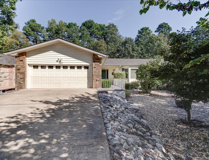 Stylishly Renovated Ranch Home in Hot Springs Village  Welcome to this beautifully updated one-level ranch-style residence nestled within the secure, gated community of Hot Springs Village. Renovated in 2024, this move-in-ready home boasts exceptional curb appeal with manicured landscaping and a thoughtfully designed interior.  Key Features:  *Modern 2024 renovations: wood flooring, sleek kitchen, and updated bathrooms *Spacious open-concept layout ideal for everyday living and entertaining *Bright screened-in sunroom/Arkansas Room with skylights and scenic views *Outdoor deck perfect for relaxing or hosting guests *Cozy breakfast room and dedicated laundry area *Elegant primary suite with trayed ceiling and walk-in closet *Professionally low maintenance landscaped exterior for year-round beauty  Community Amenities: HSV offers a vibrant lifestyle with access to pickleball courts, swimming pools, theaters, civic clubs, churches, medical services, shopping, hiking and biking trails and many dining options within minutes.  Whether you're seeking comfort, style, or an active community, this home delivers it all. Schedule your showing today and experience the best of Hot Springs Villag