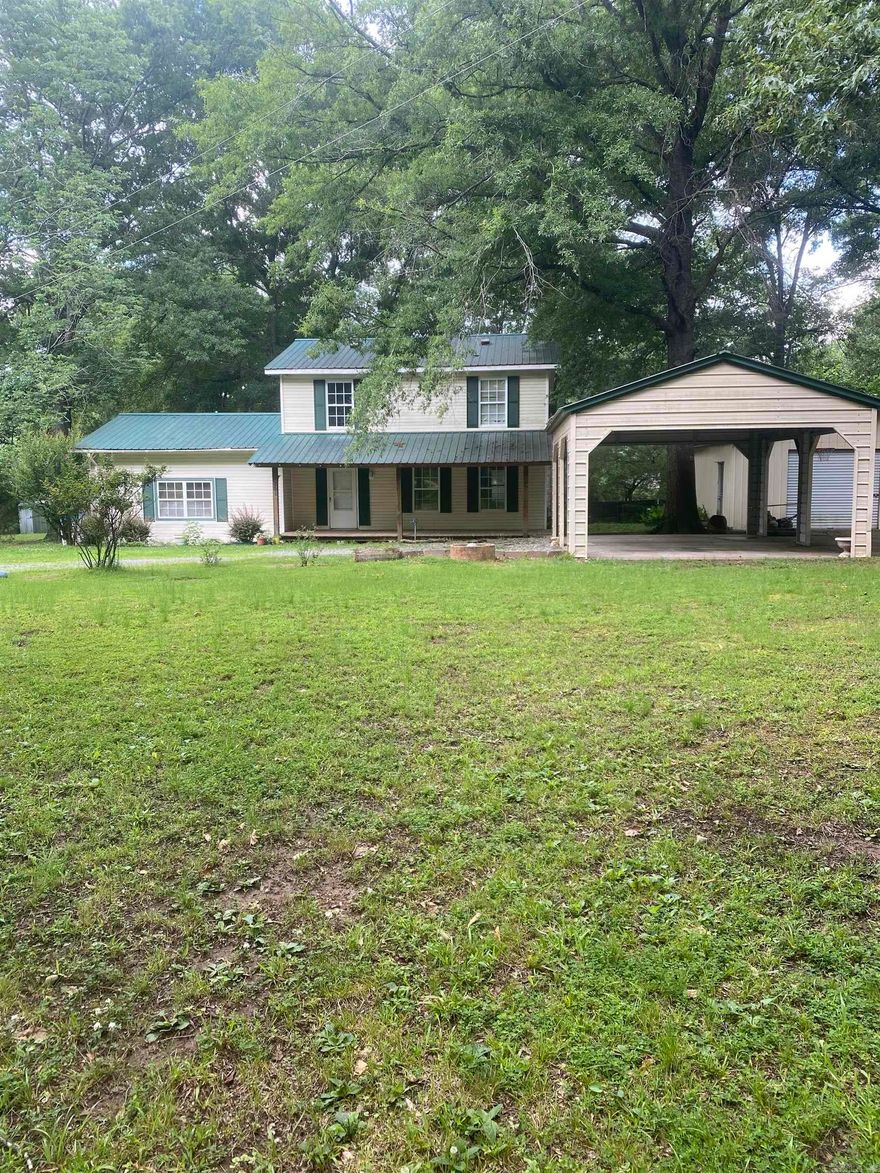 Opportunity awaits in a prime Bryant location! Situated on a private, gated 1.68-acre wooded lot within the Bryant School District and just seconds from Bethel Middle School, this property offers incredible potential for the right buyer. Featuring 4 bedrooms, 2.5 bathrooms, and plenty of space to make it your own, this home is ready for updates and renovations. Outside, you'll love the peaceful setting with mature trees, a large shop perfect for storage, hobbies, or projects. The home also includes covered parking for two vehicles and ample room for additional parking or recreational equipment.