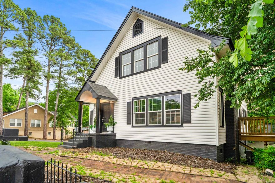 Beautifully restored 1938 historic cottage blending timeless character with  elevated aesthetics perfect for entertaining, working from home, or simply enjoying everyday living & long walks with your fur babies. This thoughtfully renovated home showcases original refinished soft pine hardwood floors, preserved stained glass accents, original doors and restored vintage glass doorknobs that honor the home’s architectural charm. A Light-filled sunroom with walls of windows creates the perfect sitting area, office, or flex space. Major improvements include all new plumbing, updated electrical, new HVAC units, new water heater, fresh interior and exterior paint, and many new windows throughout. The updated kitchen features quartz countertops, new appliances, and clean modern finishes while maintaining the home’s historic integrity. Renovated baths, beautiful natural light & preserved original details make this one-of-a-kind property truly move-in ready, virtually maintenance free. Conveniently located with easy access to dining, shopping, and business districts, this distinctive property offers the rare opportunity to own a piece of history without sacrificing contemporary convenience.