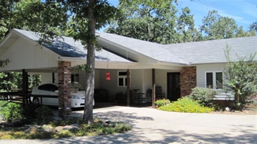 Space plus room for the In-Laws! Beautiful private wooded setting with 3.66 acres & 2 Homes.  Main house has 1811 s.f., 2 BR/2B with vaulted ceilings, all wood floors except tile in baths, solid surface countertops in kit, gas range w/elec. oven, upgraded stainless appls.; formal DR can be easily converted to 3rd BR. Guest house has 876 s.f. with 1 BR/1B, kit/brkfst & LR. 2 car detached gar & a 2-car carport; whole house generator in Main House;  FP w/gas logs in main house, approx. 936' of workshop/stg.