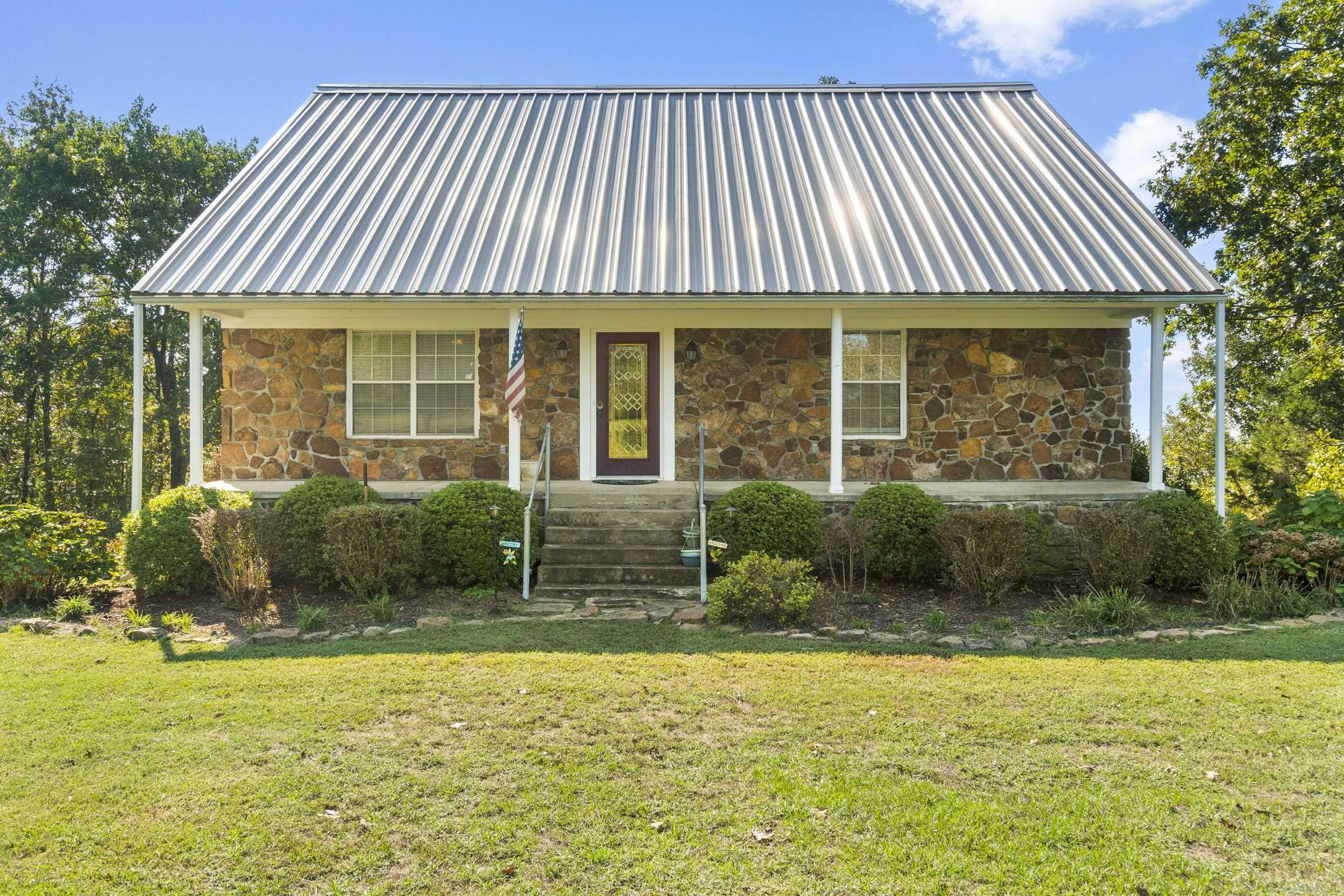 One-owner, custom-built three-story rock home featuring 3 spacious bedrooms, 3 full bathrooms. This property offers plenty of room for both relaxation and recreation, including a small game room, a safe room on the lowest level, and multiple living spaces filled with natural light, plus outdoor elevator. Nestled on 8.32 acres, the land provides a wonderful balance of cleared yard with established garden areas and a wooded downslope for added privacy and natural beauty. A shop on the property offers ample storage and utility space. Whether you’re looking for a serene homestead, a family retreat, or a place with room to grow, this unique property blends comfort, security, and outdoor living in a peaceful Pangburn, Arkansas setting.