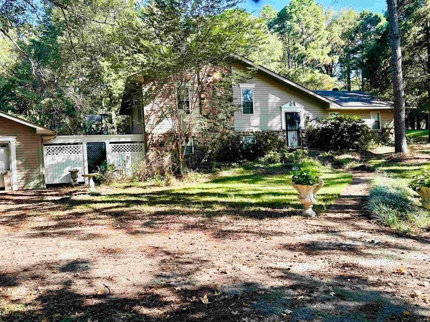 Spacious 4 Bed/3 Bath home on a serene tree-filled 1-acre lot. This expansive 4-bedroom, 3-bathroom home offers ample space for your family and entertaining guests. The full finished basement is where you while find the second living area, fourth bedroom, full bath and the laundry room. Detached 2-car garage with workshop: Ideal for car enthusiasts or DIY projects. Privacy fenced backyard: There are two A/C units; one unit is just a year old. Other recent updates include a new water heater and roof were both replaced last year. Don't miss out on this incredible opportunity! Schedule a showing today!