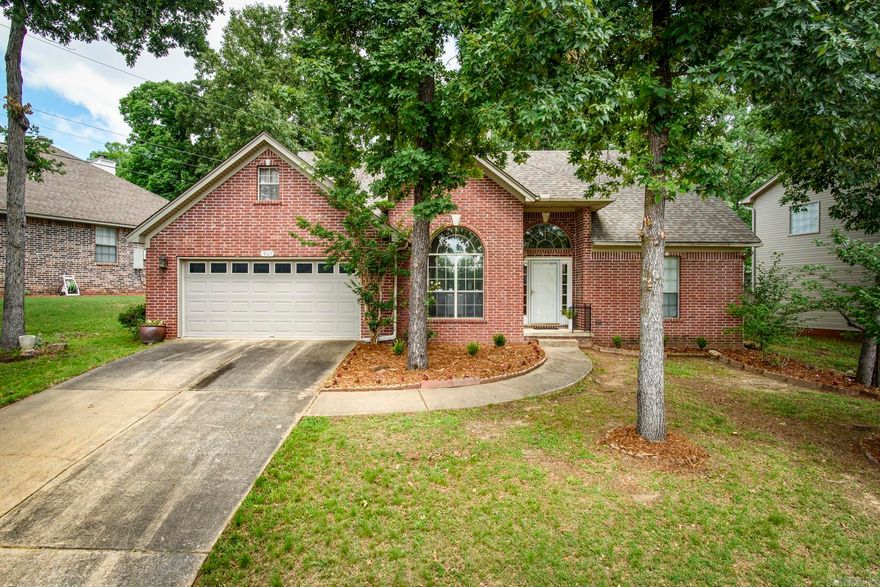 Welcome to 1907 Cherrybend! Ideally located in West Little Rock with convenient access to shopping, dining, parks, and everyday amenities, this home offers a fantastic opportunity to make it your own. The inviting living room features a gas log fireplace and flows into the eat-in kitchen, creating a comfortable space for daily living and entertaining. A formal dining room and laundry room are conveniently located on the main level. The spacious main-level primary suite includes access to the back patio, an en-suite bath, and walk-in closet. Upstairs, you’ll find two additional bedrooms and a full bath. Outside, enjoy the fenced backyard, patio area, and 2-car garage. A Generac generator adds extra peace of mind. With a great location, functional floor plan, and plenty of potential to add your personal style and updates, this home is ready for its next chapter. Agents, please see remarks.