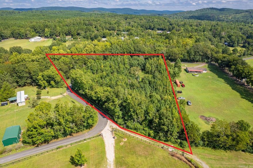 3.6-acre corner lot on Barbershop Trail with paved road frontage, level ground, and prior homesite with well, septic, and power available. Out of city limits in Garland County, Mountain Pine School District. High-speed internet service is nearby. Minutes to Lake Ouachita, Lake Hamilton, and Hot Springs. Ready for your new home, manufactured home, or weekend retreat.
