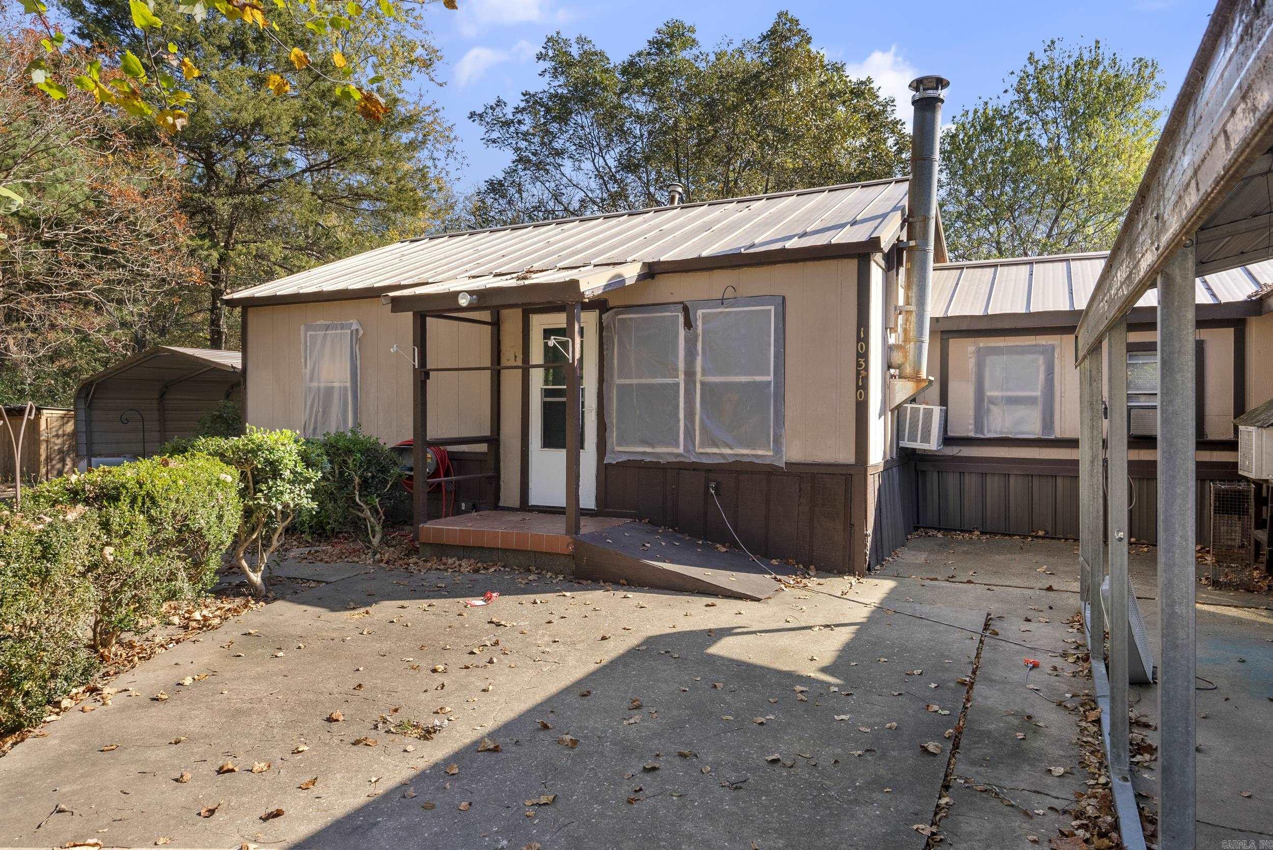 Nestled in the charming community of Mabelvale, this cozy 2-bedroom, 2-bathroom home sits on a spacious one-acre lot, offering ample outdoor space perfect for those who appreciate country living. With 1,000 sq. ft. of warm, inviting space indoors, the home is ideal for anyone seeking a tranquil setting. The fully fenced yard provides a secure area for pets or even a small flock of chickens, making it a great mini homestead. Additional features include a spacious shop and outdoor storage, perfect for hobbies, DIY projects, or extra storage needs. The property also includes two carports, adding a layer of security and convenience. Embrace the peaceful, rural lifestyle this Mabelvale home offers while still enjoying easy access to city amenities. Don’t miss out on the opportunity to make this charming property your own! THE SELLER IS SELLING AS IS!