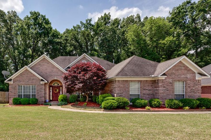 Gorgeous home on quiet culdesac and backs up to woods--so serene!  Fenced yard with oversized deck for family cookouts.  HUGE living area with hardwoods and high ceilings and granite surround fireplace.   Kitchen features granite counters and tumbled stone backsplash...plus stainless appliances. Raised floor to formal dining area. Medallions with ceiling fans. See list of improvements to appreciate "pride of ownership".  Upgraded landscaping features, too. Refrigerator and lawn mower stays! See agent notes.