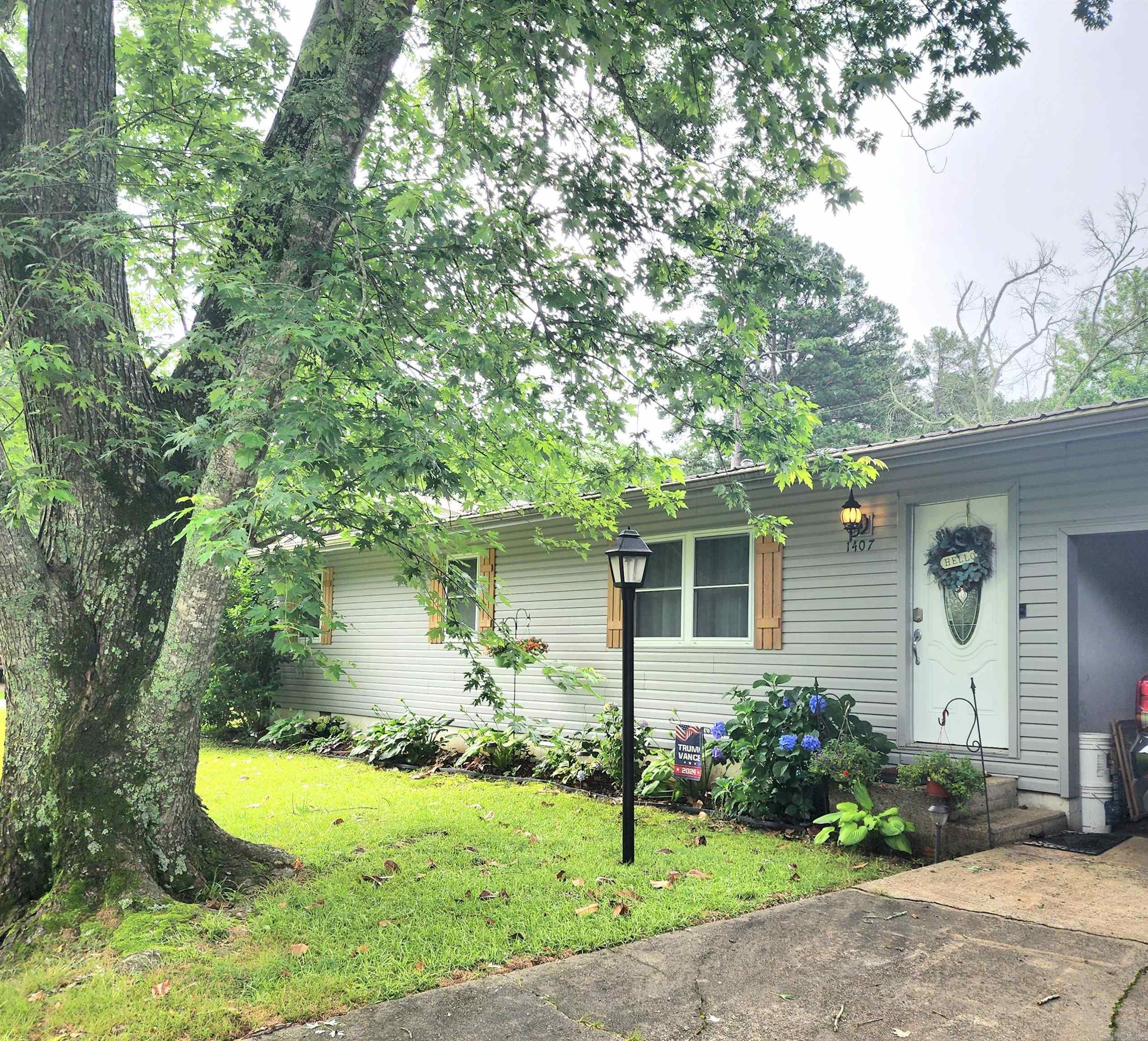 Don't miss this MOVE IN READY 3-bedroom, 2-bath home located within walking distance to local schools, Greers Ferry Lake, and Sandy Beach! This move-in ready home offers both comfort and convenience in a peaceful, lakeside community. Step inside to find a spacious layout featuring a large addition at the back of the home—perfect for a den, craft room, office or potential 4th bedroom. The home has seen major upgrades including a new HVAC system and wood privacy fence in 2021, as well as a metal roof, gutters, siding, windows, and water heater all replaced in 2014. Out back, you'll enjoy a fenced yard with a patio and pergola that's perfect for entertaining, plus a powered storage building/workshop ideal for hobbies or extra storage. Call today for your showing. Agents see Remarks!