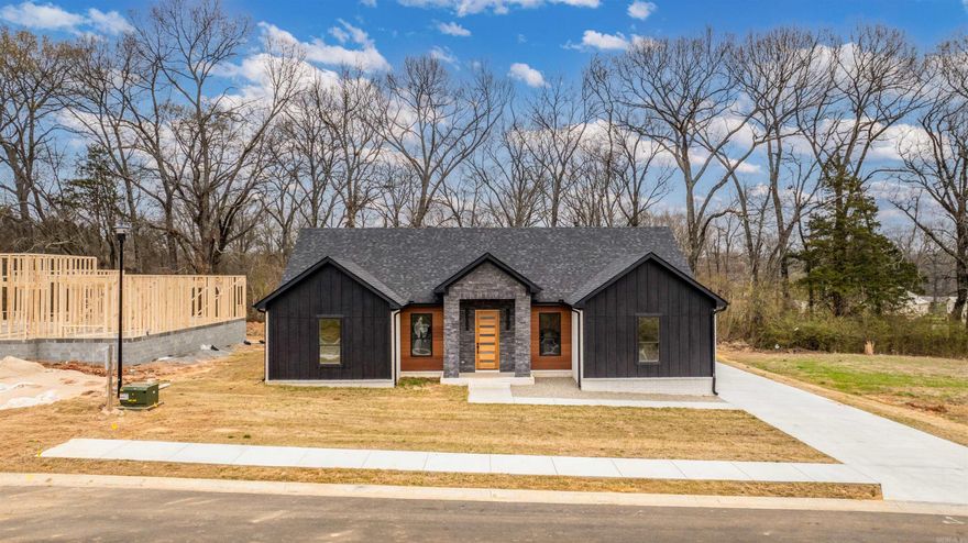 FENCE INCLUDED** This is your chance to own a 1 of 1 Paragon Builders designer spec home! 2410 sqft of quality living, featuring 4 bedrooms & 2.5 bathrooms. Custom handcrafted cabinets with black hardware & soft close hinges covered in elegant Crème & Tricron Black Sherwin Williams paint. Kitchen island stained in rich mahogany to match the real mahogany wood front door, as well as the tongue & groove wood siding on the porch ceilings. ALL gas appliances from Metro. Allusion Edge gas fireplace in the living area. Luxury kitchen sink. Black quartz countertops. Spray foam insulation on all exterior walls, including the garage. 18x8 flush panel insulated garage door. Dual Fuel HVAC system. Tankless water heater for never ending hot showers! lvp flooring in the main areas & bedrooms. Tile for all bathrooms & laundry room. Delta plumbing fixtures (black). Luxury lighting throughout. Largest driveway in the existing neighborhood with a oversized entertaining patio on the back of the home. Owens Corning shingles. Westlake high E windows. White Bluff brick & Granite stackstone from Acme. James Hardie & Mac Metal siding. Dont miss your chance to own this designer spec home from Paragon!