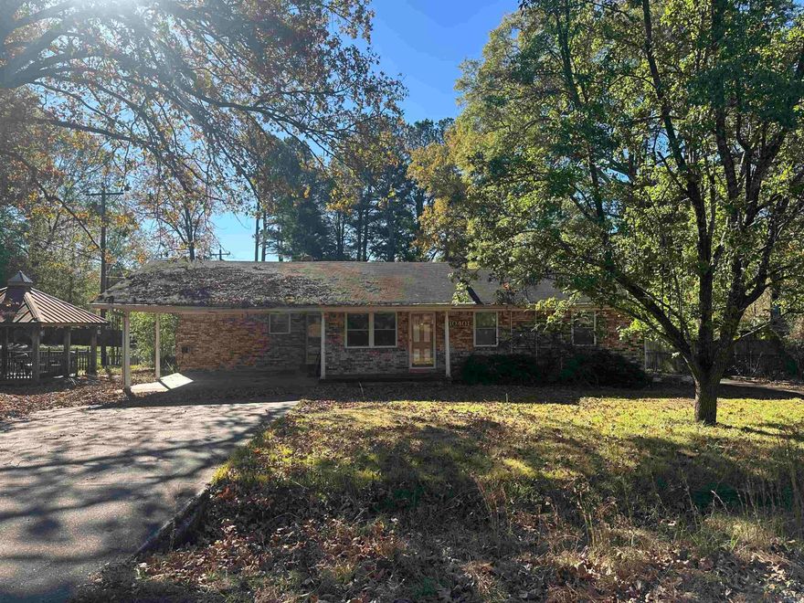 Calling all investors!! This home has great bones and would make an awesome flip or rental.  Good size bedrooms, large living area/Great room with built-ins that include a gun rack and ample storage.  Flooring has been removed in some rooms.  This home is located on 0.49 of an acre.  Has two separate driveways and a large 30x40 shop/barn with electric.  This would make a great 2nd rental, In-law quarters or small business. Small gazebo to the right of carport for extra entertaining space.   This has so much potential!  Call today for more info. **** Agents please see remarks ****