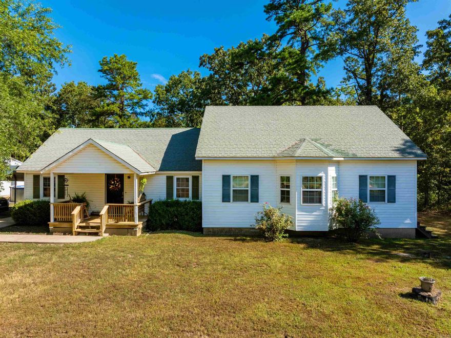 This gorgeous country home sits on 13± acres in Sharp County, just minutes from Hardy, AR and the Spring River. With mature shade trees, wooded acreage, a pool, and a shop, it offers the perfect mix of comfort, charm, and outdoor living. Inside, the spacious dining area flows into a remodeled kitchen (2020) with a large island and room for a full table. The living room anchors the home, leading to the primary suite with walk-in closet and large bath. Another bedroom off the dining area includes a sitting area with access to the pool deck. Upstairs, a large open bonus room is perfect for a game room, theater, or additional bedroom. Updates include roof (2009), two central heat/air units (1998 & 2009), and complete rebuild to the studs in 1997. The 13± acres include a two-car garage/shop with space for living quarters and plumbing for a bathroom, plus plenty of room for hunting, recreation, or livestock. Utilities include well water, propane (owned), and central HVAC. Located on paved Hwy 175, this home offers privacy yet is close to historic Hardy for shopping, dining, and the Spring River, and within ~1 hr 20 min of Jonesboro for healthcare, university, and major retail.