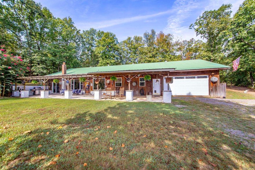 Tucked away in a peaceful and private setting, this 3-bedroom, 2-bath earth-sheltered home sits on 37 acres with a large, beautiful pond and plenty of space to roam. The open design features 9.5’ ceilings, a spacious office that could easily serve as a 4th bedroom, and thoughtful updates including geothermal heat and air with backup wood heater, new windows, flooring, concrete countertops, and recessed lighting. The master suite boasts a large steam shower and its own heater for extra comfort. A central heated and cooled garage—currently used as a shop—plus a pantry and laundry room with utility sink add convenience. Outside, fruit and nut trees, a barn with water and electricity, and plenty of pasture make it ideal for horses or livestock. A one-of-a-kind property with modern comfort and country charm!