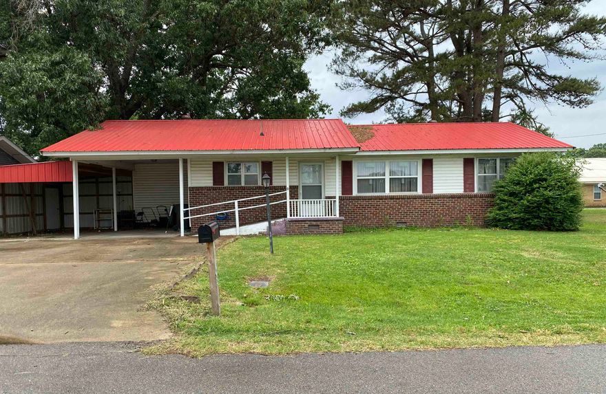 Three bedroom, two bath brick home located on a quiet street. This home features a large open kitchen and dining area with new floor covering, a utility and master bath combo, and some updated windows throughout the home. The HVAC was replaced in 2020 and the roof was replaced in 2023. Kitchen appliances include a new refrigerator and dishwasher.  Outside you will find a fenced backyard with plenty of shade, a small storage building, an attached carport, and an additional lean to for extra parking or covered storage. A great option for buyers looking for an affordable home with several important updates already completed.