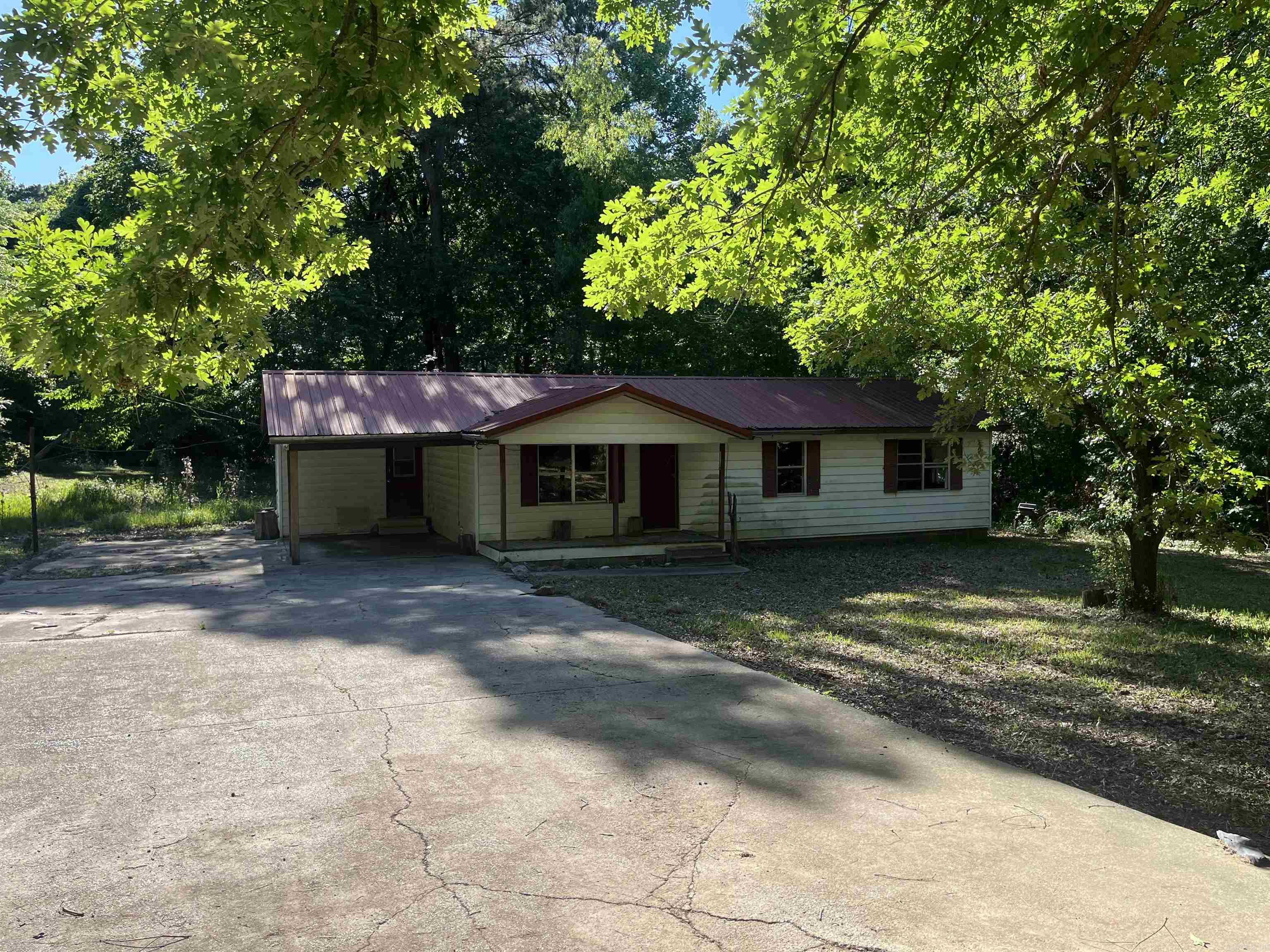 Unlock the potential of this 3-bedroom, 1-bathroom home on a beautiful 2-acre lot. With 1,128 square feet of living space, this property is perfect for those with a vision to restore. The shaded lot provides plenty of privacy while also being close to town.