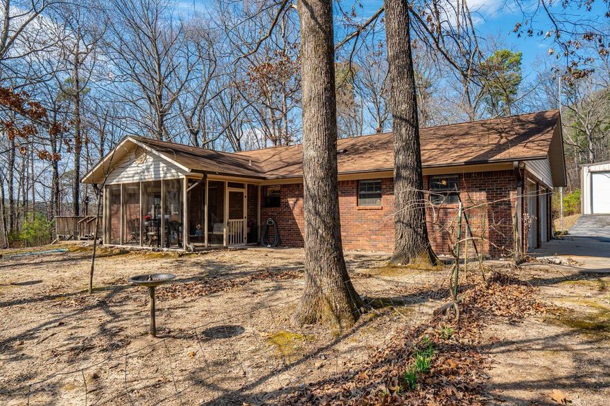 You have been waiting for this! Lovely brick home on 15 acres minutes from Lake Ouachita. Wonderful frontage on 270 for spreading out, family compound or just relaxing! Outside you find a 20 x 40 deck, 12 x 16 screened porch and some chicken coops if you are so inclined! There is a wonderful 25 x 40 commercial shop with electric and plumbed. Poured RV pad with utilities. All electric home but has propane generator for those harder times. Lots of 270 frontage with secondary deeded entrance on west side. New fridge conveys as well as washer and dryer.  New dishwasher. 3 wells. Property goes a bit on the east side of the road. New well tank 2024. New water heater, wood stove with blower, gun safe bolted in closet conveys. Built to last with 2x6 insulated walls! Well has water softener. Window treatments convey. 1/2 mile from Mountain Harbor, 2 miles from Camp Charlton!