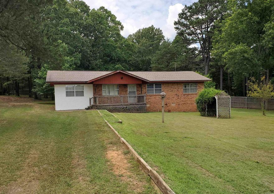 Beautiful Property in the Country! This 3 bedroom 1 bath home needs some updates and TLC. It has a newer roof, a 25x40 shop/barn, a sweet 16x24 shed/craft/storage building. A wooden gazebo in the back yard. The garage has been converted to living space open to the main living area of the house. The property is mostly wooded and has some fruit trees and some beautiful established landscaping. It is being sold "as is". Agents please see remarks.