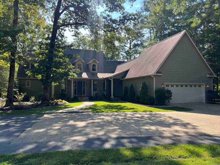 This immaculately maintained two-story home seamlessly blends modern elegance with rustic charm. Featuring original 120-year-old barn wood paneling and a warm and inviting fireplace, this house exudes timeless warmth and character. Set on four beautifully landscaped acres, the property offers stunning views of a serene 12-acre stocked pond, providing a peaceful backdrop.  The kitchen features a large tiled island, pantry, stainless steel appliances including a wine fridge and abundant cabinets for storage. The spacious primary suite is located downstairs and features  walk-in closet, double sinks in the vanity, a large garden tub and a beautiful tiled shower. Upstairs you will find three guest bedrooms with ample closet space and two full bathrooms.  If you are looking for peaceful serene living, WELCOME HOME!