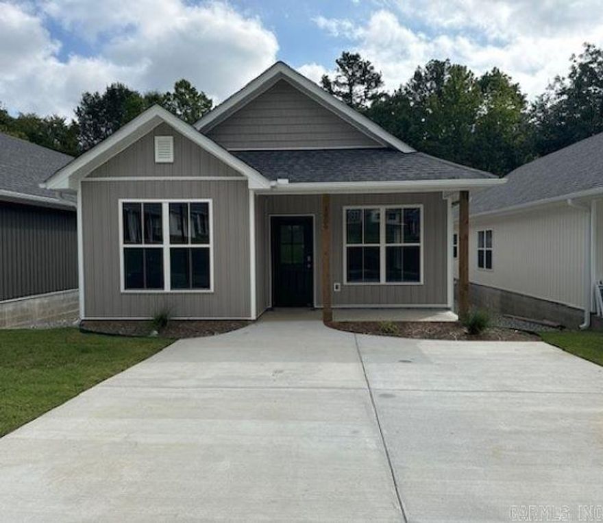 1 year builder warranty offered! Closing costs concession is a possibility with the right offer! NEWER SUBDIVISION off Rodney Parham Rd., near Leawood & Breckenridge. Come take a look at this modern home in Hillcreek Village! A beautifully thought-out floor plan that includes luxurious finishes throughout; Along with a residents only dog park, fenced-in green space and a pickleball court just steps away! This charming home boasts an individual (2-car) parking pad, single level entryway, and space for relaxing or entertaining! This location provides access to all that Little Rock has to offer. Interstate access is only 0.6 miles from Hillcreek Village in addition to conveniently located essential services, shopping, dining, and transit, making 1009 Brookside Dr. highly desirable for comfort, convenience, and lifestyle! Upscale granite countertops, stainless appliances, covered front porch, fantastic wooded view in the backyard with an extended deck, full size laundry room, luxury vinyl flooring, custom walk-in closets, and a covered, private back patio. Several photos are staged rooms from the model home in the subdivision with similar floor plan. Staged photos are notated.