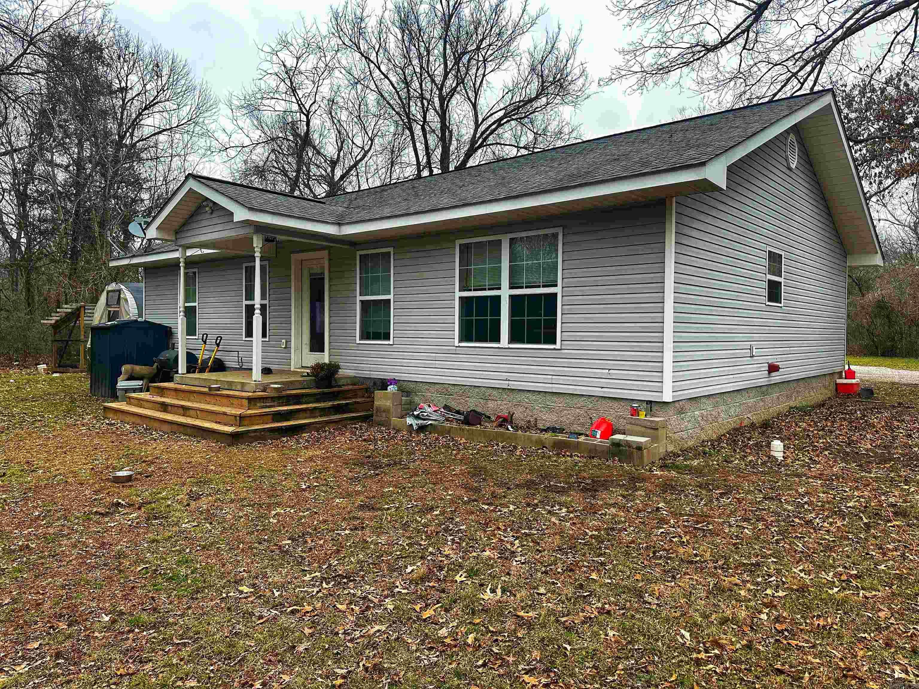 Tucked in the woods, just a few miles from Batesville city limits, you'll find 34 Pearl sitting on just over 1.5 acres! This lovely custom built home was laid out with thought! It offers an open floor plan with tray ceilings in the living room, crown moulding, and a spacious kitchen with plenty of CABINET SPACE!!! The two bedrooms are generous in size! The main bedroom has an attached bath complete with shower, large soaker tub, a double vanity, and a walk in closet! Attached to that bathroom is a large laundry room/mud room for added convenience! Outside you'll find plenty of space to garden or relax with no neighbor in sight! Chicken coop conveys if you'd like to bring your feathered friends!