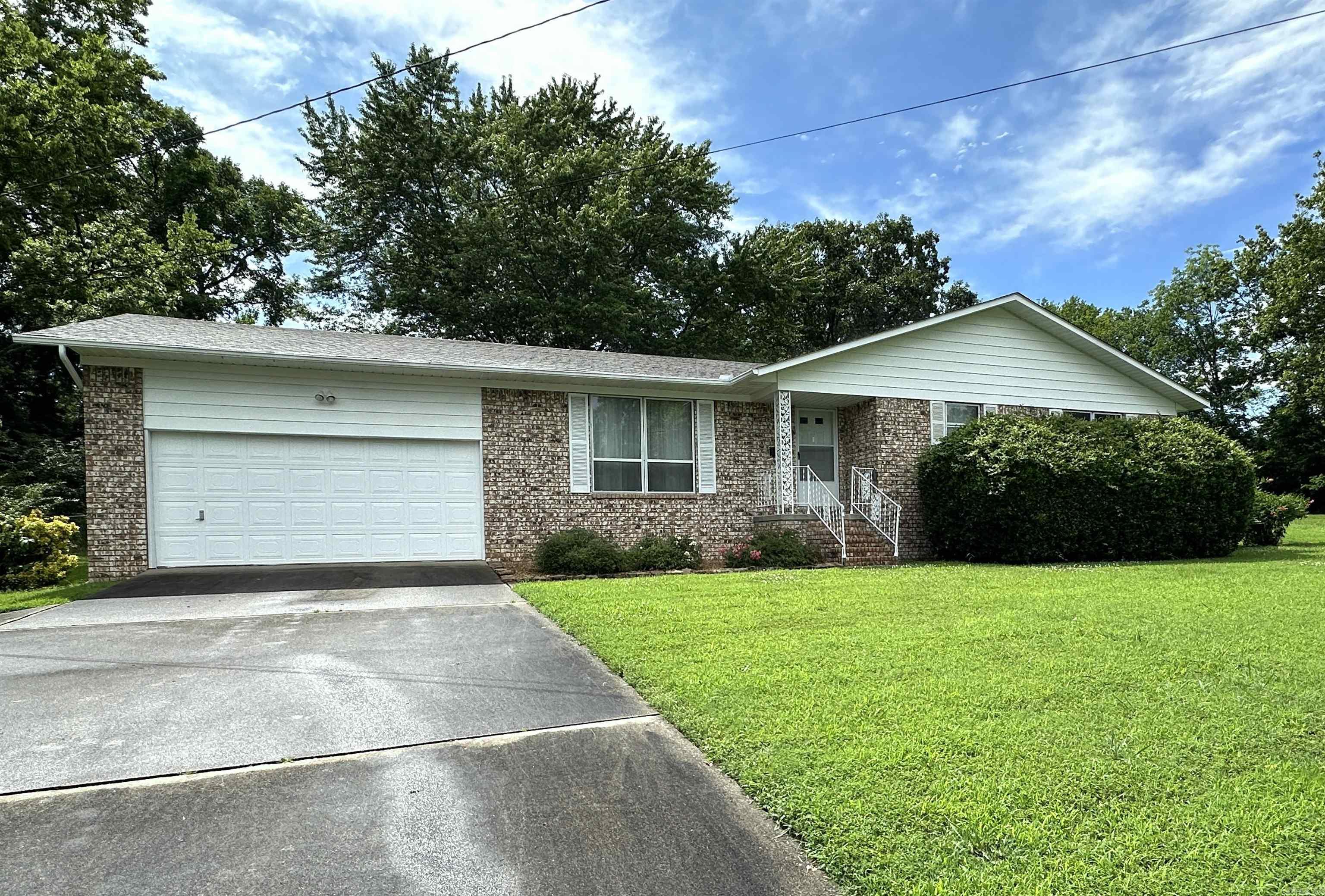 Beautifully maintained brick home with many improvements. New architectural shingles and Lennox HVAC unit 2019, New garbage disposal, exterior paint and porch screens 2025, New interior paint, flooring & electrical outlets & switches 2016. All appliances convey with the property (refrigerator, gas stove, washer & dryer). 2 spacious master bedrooms with private baths and large closets. There is an addition 1/2 BA in the hall along with more closet space. Comfortable living room that flows into the dining/ kitchen area & separate laundry RM. Large fully fenced backyard with storm cellar, storage building and screened back porch. The garage also has addttional storage space. Sandy Beach & schools walking distance away. Don't let this one slip away, call for an appointment today!