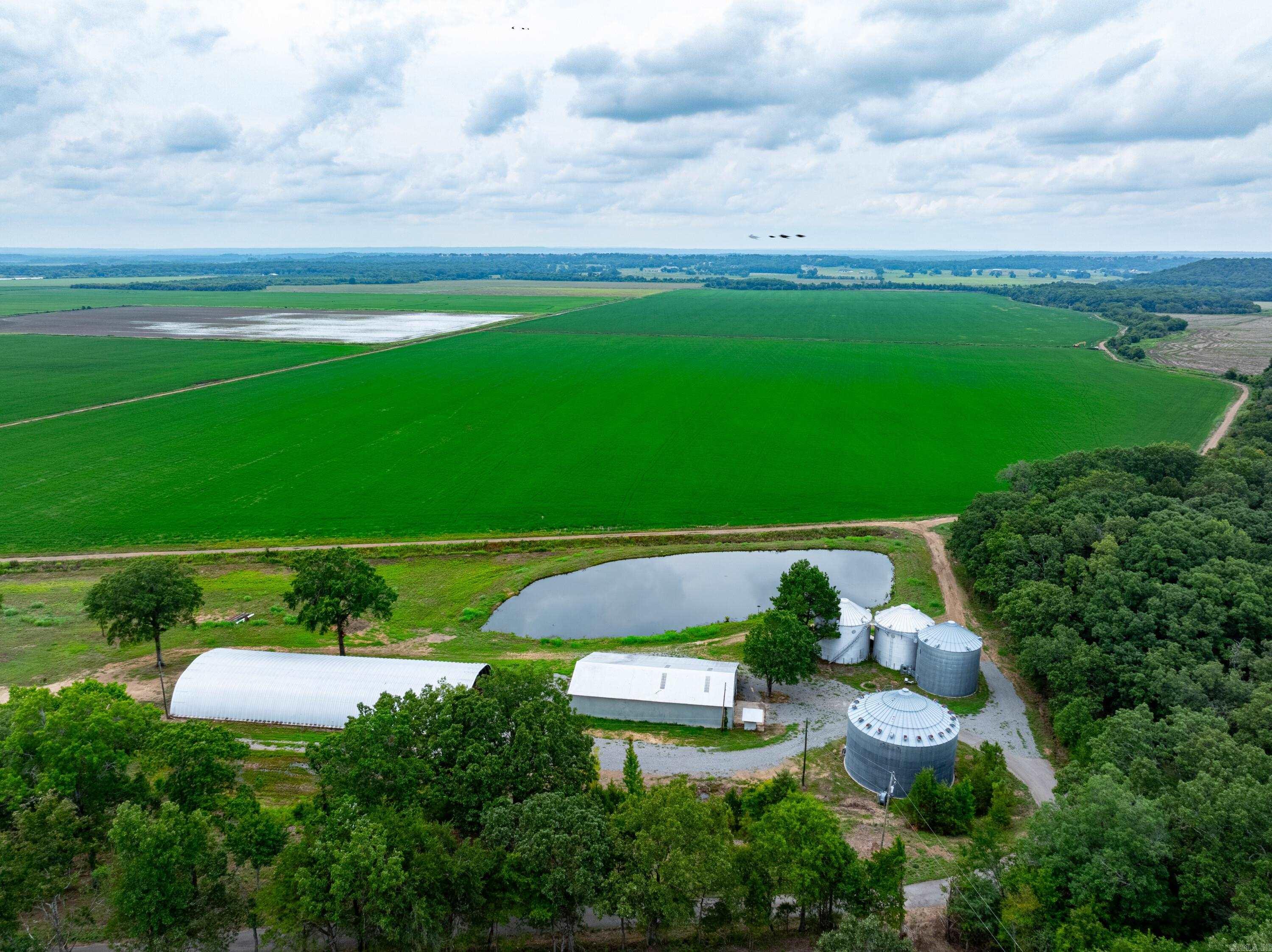 This 335± acre turn-key row crop farm is located just 5 minutes from Conway in the Cadron River Valley. Featuring zero-grade fields, surface water irrigation from the Cadron River, and underground pipe/gravity flow systems, this property is ideal for rice production and is eligible for migratory waterfowl programs. The farm consists of 4 fields with roads around each, providing excellent access for equipment. Beyond farming, the property offers outstanding duck hunting potential with shallow water capability to attract waterfowl. With shifting migration patterns and neighboring states converting farmland into habitat, this tract is uniquely positioned to hold ducks before they reach the Delta. The farm also has potential to qualify for a Wetland Reserve Easement (WRE), offering conservation benefits, income opportunities, and hunting access. With row crop land prices rising across Arkansas, this property represents a smart investment with multi-use potentialāfarm, hunt, and conserveāall in one.