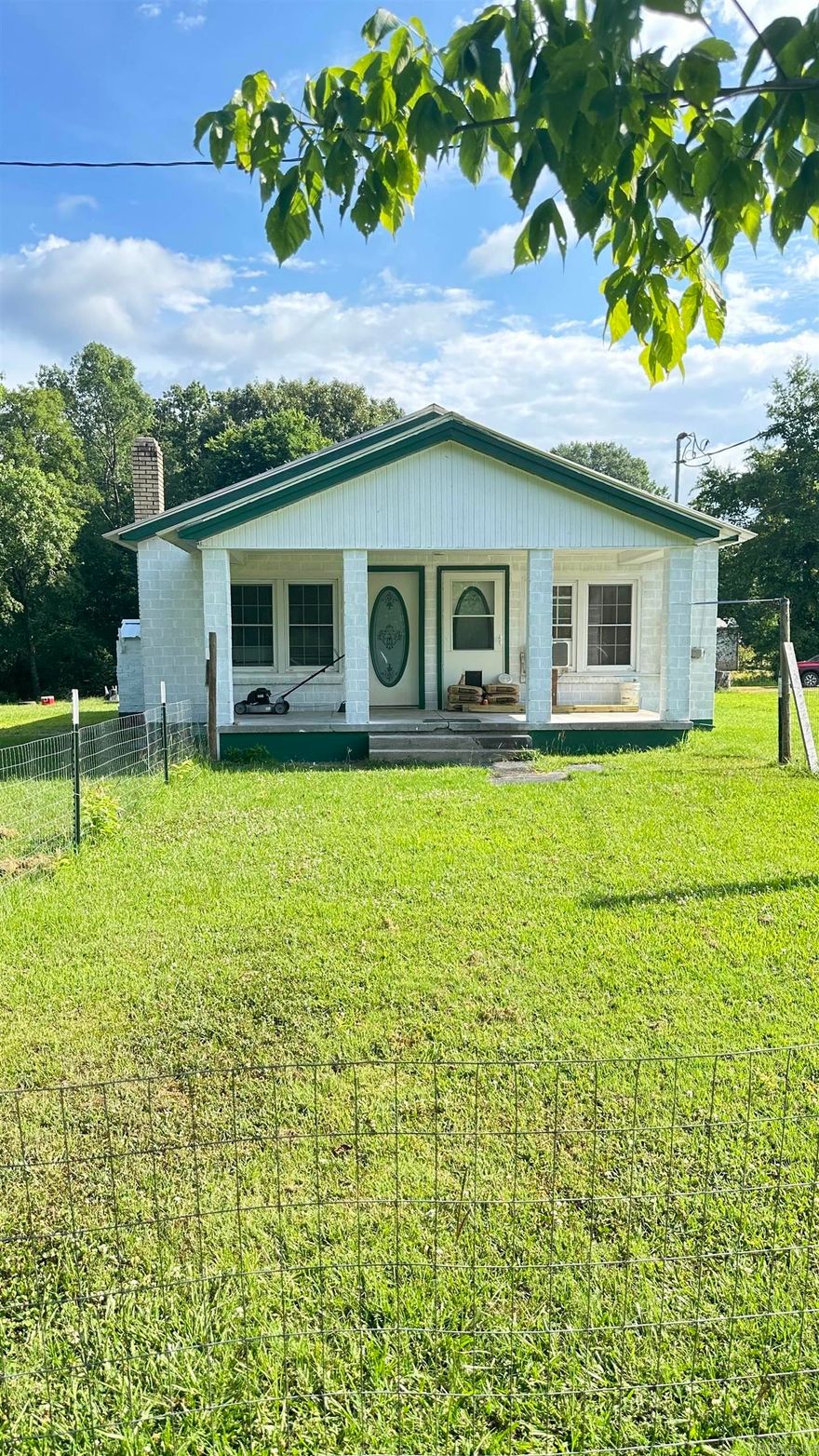 Great Starter home or investment property. Home features 2 BR/1BA, Kitchen with Island Bar. Spacious Living Room with Fireplace (gas insert).  Property located next to creek bank. New Carport(12x30) and New Septic System in 2024.  Agent see showing remarks and agent remarks.