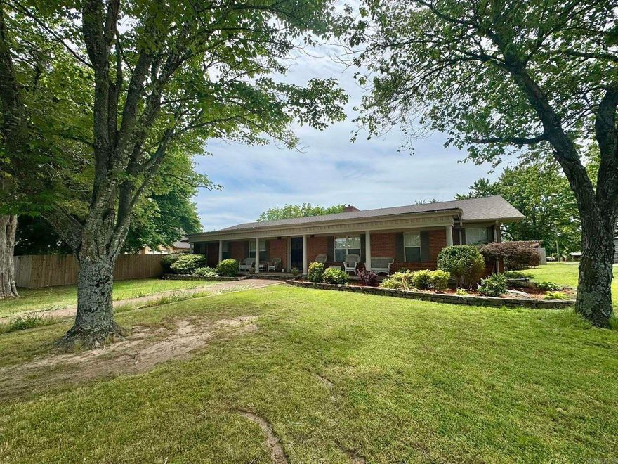 This exquisite 4-bedroom home features 3 full bathrooms and a multi-purpose game room as well as an additional bonus room providing ample space for family living and entertainment. The expansive 3-car garage includes room for workout equipment and an inground storm shelter for added security. The backyard is a tranquil retreat with a fenced-in ground pool that has a new liner installed in 2023, an outdoor fireplace, and stunning mountain views, all set in a spacious concrete backyard area. Indoors, the home is equipped with both wood-burning and gas fireplaces, as well as CH@A creating a cozy and inviting atmosphere. Recent improvements include a new roof and a remodeled bonus room and guest bathroom, adding both style and functionality to the property. This home offers a perfect blend of luxury, comfort, and peace of mind. Conveniently situated on Main Street in the heart of downtown Mtn View, it is zoned for both commercial and residential use.