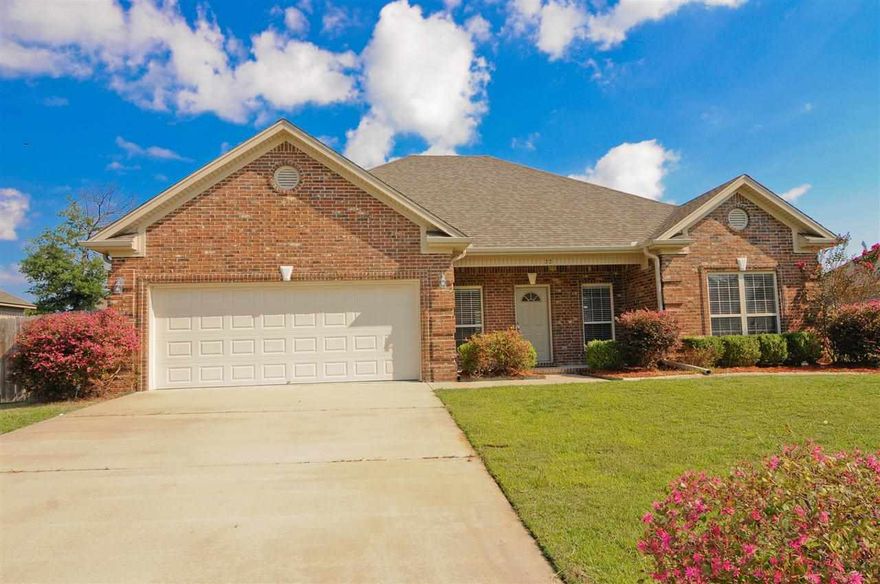 All brick, front porch, fully guttered, fully fenced with double gates covered patio & large, two  car garage with extra storage room near end of cul-de-sac. Open floor plan, tons of oak cabinets space, & center kitchen island & pantry & built in desk. Brand new hardwood floors in living room with gas fireplace. Master has double vanity, jetted tub, separate shower his & hers walk-in closets. Fresh neutral colors, very nice, must see. TWO YEAR HOME WARRANTY OFFER BY SELLER!!!!