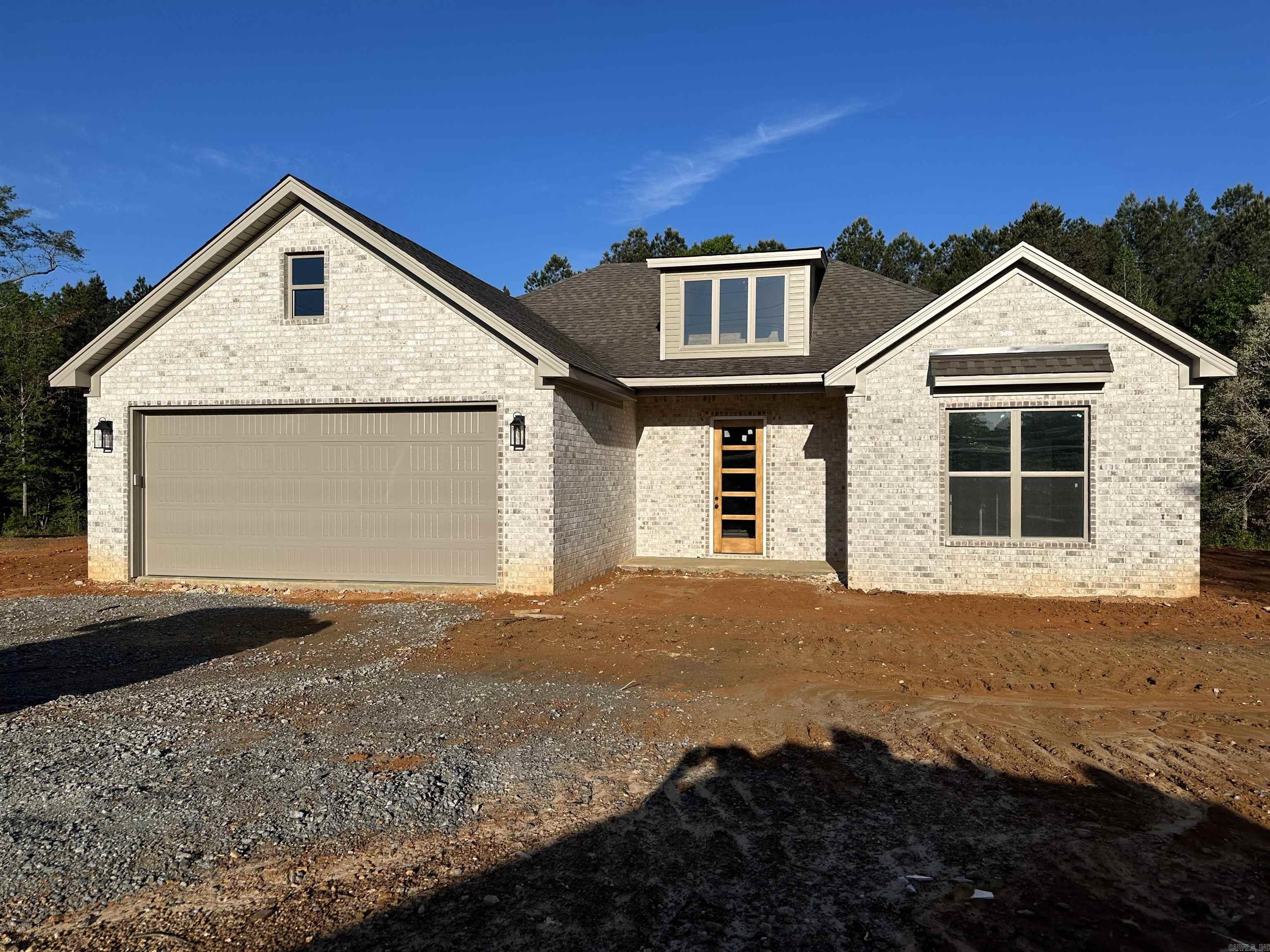 Charming new construction home beautifully designed 3 bedroom, 2.5 bath residence in a friendly neighborhood. Step inside, you will be greeted with a spacious and open floor plan with plenty of natural light. The modern living area flows seamlessly into the dining space, making it perfect for entertaining friends and family. The gourmet kitchen boasts stainless steel appliances, ample cabinet space, and a convenient breakfast bar. The generously sized master suite offers private retreat with an ensuite bath featuring a soaking tub, double vanity, and a walk-in closet. 2 additional bedrooms, perfect for family or guests, share a well appointed full bath. Enjoy the convenience of a main level laundry room and half bath for guests. The outdoor space includes a lovely backyard with a patio, ideal for summer barbeques and relaxation. Don't miss your chance to live in this wonderful space.