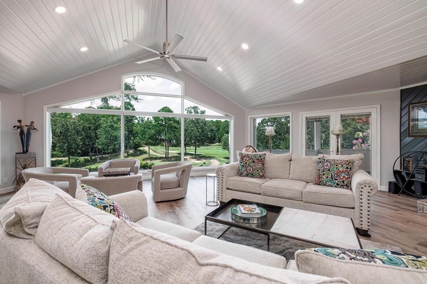 !!!A Golfer’s Dream Home!!!!  Inquire regarding the Sellers Gold Member Incentive!   Positioned on one of the most expansive golf frontage lots in the village, this home is a hole-in-one for golf enthusiasts. Designed to take full advantage of its elevated half-acre perch, every room offers a scenic, private view of the meticulously maintained course—so you’re never far from the game you love.  From the moment you step inside, the open-concept kitchen and great room set the stage for the ultimate 19th-hole experience. Floor-to-ceiling windows flood the space with natural light, framing breathtaking views of the fairway. Vaulted 13-foot ceilings, remote-controlled drop-down shades, and an electric log fireplace (convertible to gas) ensure a cozy atmosphere for post-round relaxation. Deep architectural skylights add even more natural brightness, keeping your surroundings as inviting as a sunlit green.  The primary suite is a true retreat, with direct access to a screened porch where you can sip your morning coffee while analyzing the pin placement. Need a quiet spot to strategize your next round? A private office offers golf course views to keep you inspired.