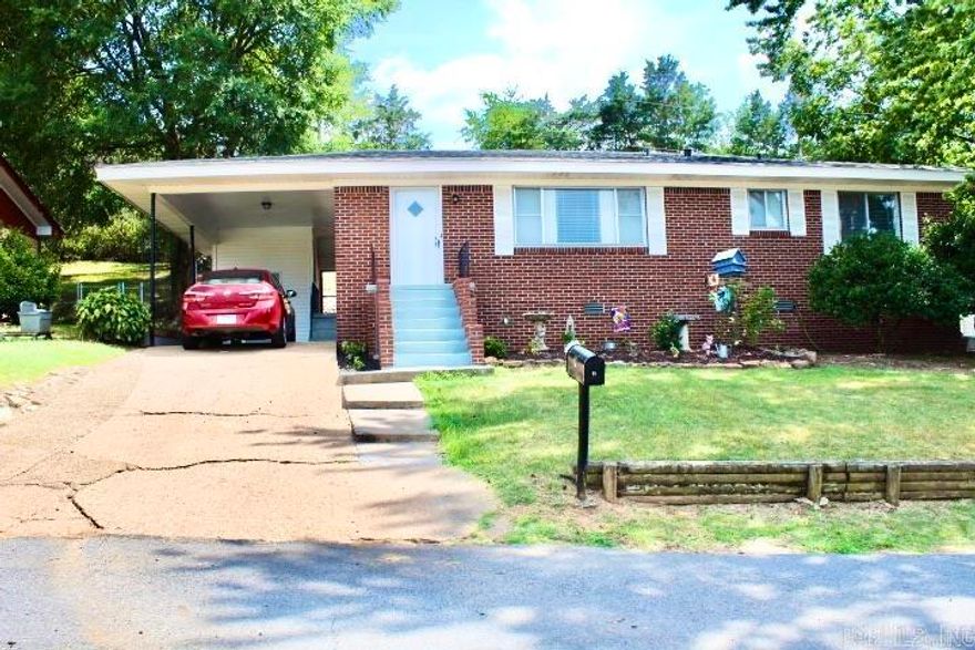 Come see this beautifully updated 3 bdrm, 2 bath residence ideally located within walking distance to Morrilton Primary School. This lovely house will welcome you HOME with beautifully re-finished hardwood floors, freshly painted walls, updated bathrooms and new storm doors that were recently installed on the front and back   entrances.No need to worry about the roof; it was replaced in 2023! Flower beds in the front and on the side add a lovely touch in turning this house into a home. Schedule your showing today and let us show you how easy it is to make an offer, buy yourself a house, move in and enjoy your new place to call HOME!