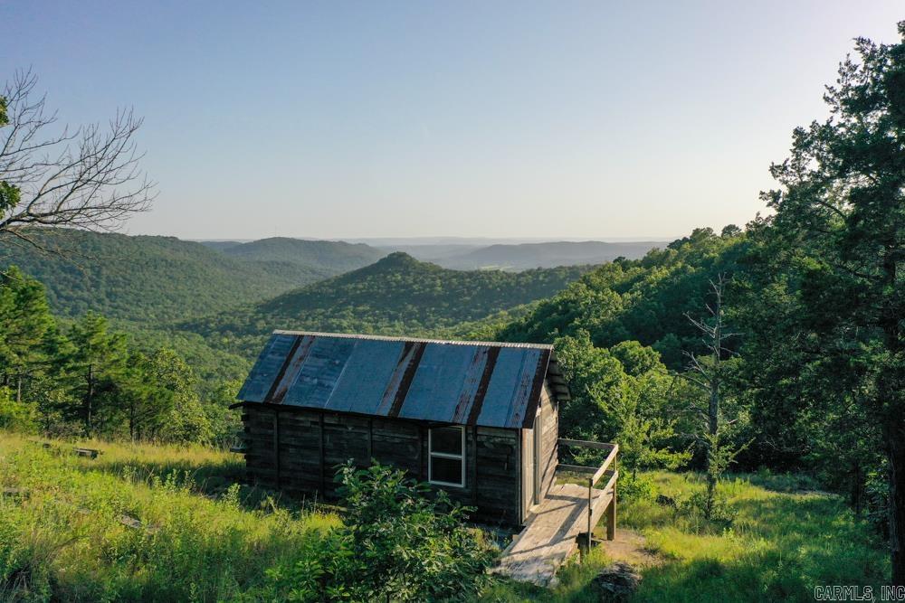 Discover 358 +/- acres of breathtaking Ozark mountain land, an outdoor loverās paradise located just 6 miles from the world-renowned trout fishing of the White River. This exceptional property features multiple natural springs, hidden caves, and a well-developed trail system ideal for hiking, horseback riding, or ATV adventures. Enjoy phenomenal panoramic views from multiple vantage points across the property. Wildlife is abundant, with strong populations of whitetail deer, black bear, and turkey, making this a premier hunting and recreational destination. Nearly the entire north boundary borders the Devils Knob Natural WMA, offering direct access to over 800 additional acres for extended outdoor exploration and unmatched privacy. Whether youāre seeking a secluded getaway, a hunting retreat, or the perfect setting for a custom lodge or cabin, this property delivers rare natural beauty and rugged Ozark character.