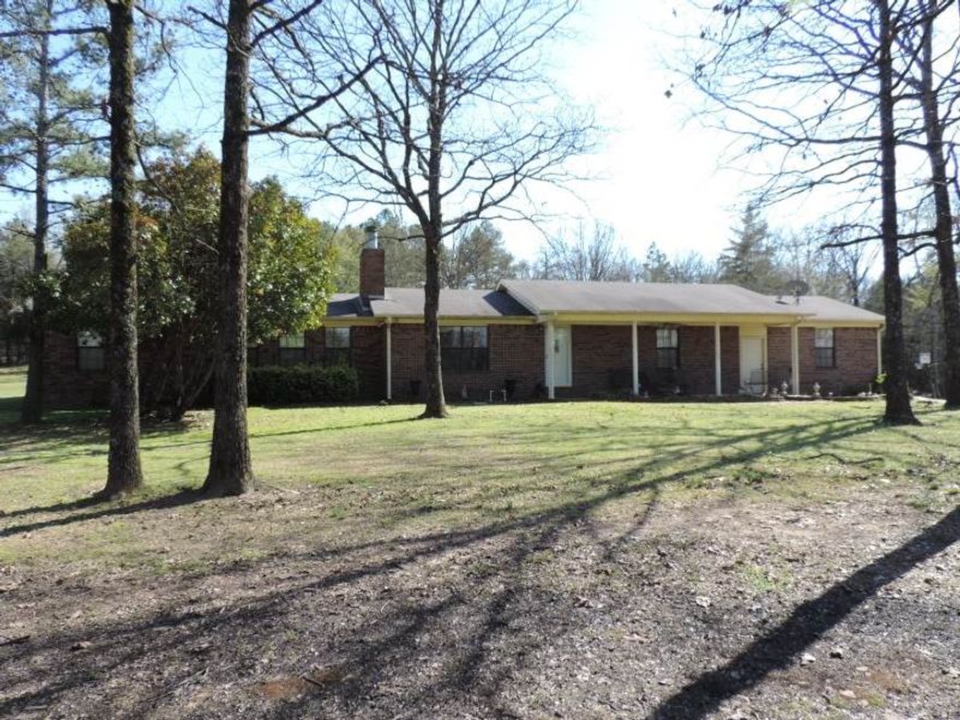 Split floor plan, 2 living areas, galley style kitchen, hidden gun cabinet, tons of storage, oversized garage, 2 separate out buildings, 3 septic tanks, 2 HWH, new AC compressor, above ground pool with deck, wood burning FP, sprinkler system, new pool liner, pump and sand trap installed, extra insulation, new 20 year roof installed. (See agent remarks.)