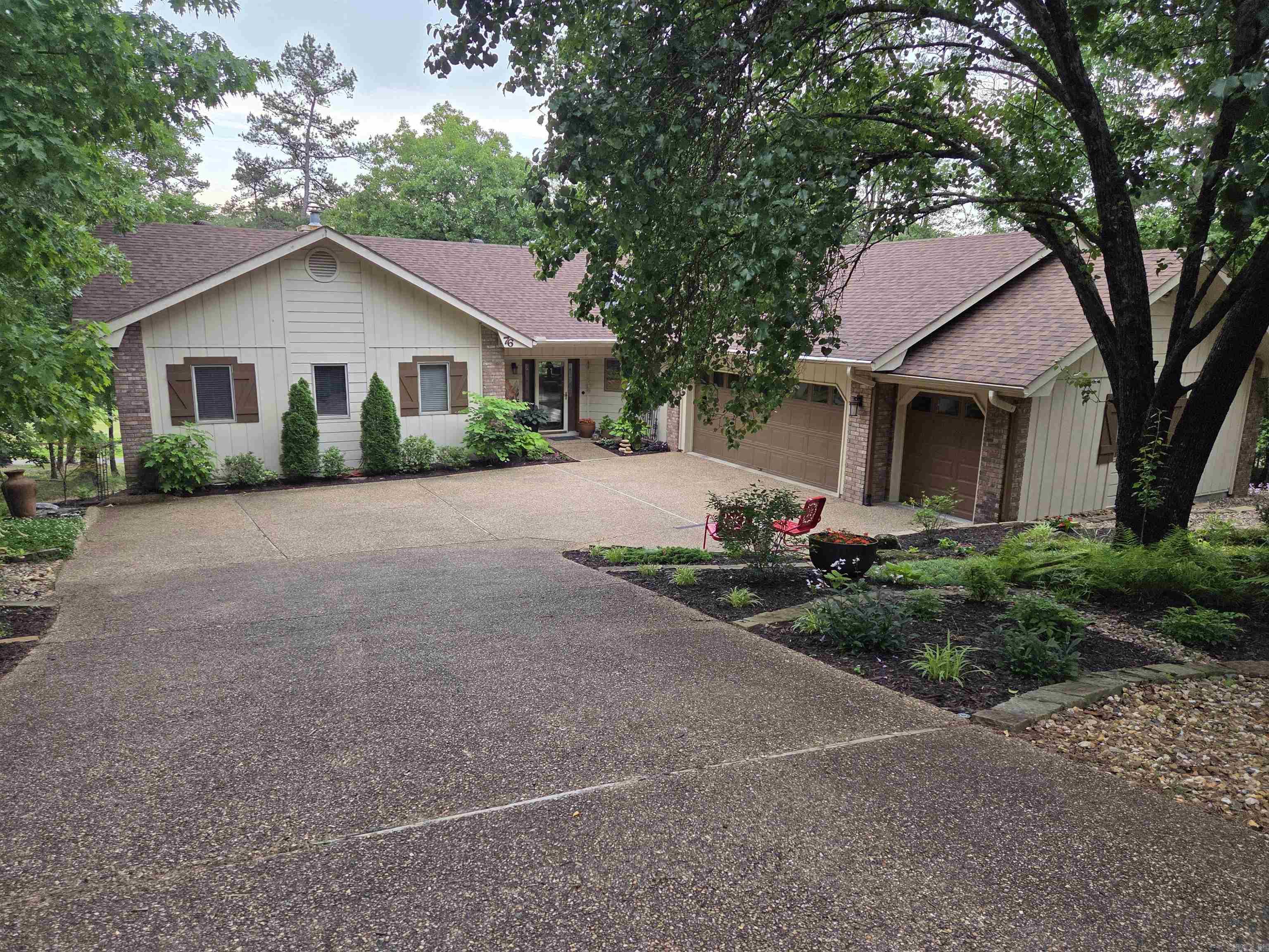 Hot Springs Village has many amenities that makes living here feel like a vacation everyday. Just beyond Balboa Golf Club, is this centrally located home. This Cooper built open floor plan home in on the 18th fairway and includes the east lot next door, which ensures your privacy; a 3 stall garage, which includes a golf cart stall w/workshop w/another workshop under the house or use for storage room; beautifully landscaped w/sprinkler and drip systems. Just think that's just the outside-Are you ready for the inside? As you open the front door to this Cooper built open floor plan home you are drawn into the all glass backside of the home w/open view of the 18th fairway of Balboa golf course. 3 skylights add even more light into this beautiful home. The kitchen to your right boasts granite counter tops, island, and custom top/bottom cabinets with slide out shelves that you'll love. The breakfast bar will be great for entertaining friends and family. The living and dining open to the sun room. Spacious primary bedroom w/en-suite. The split flrpl offers a second master bathroom for two other spacious bedrooms. Two hillside lots is a piece of privacy. Come today!
