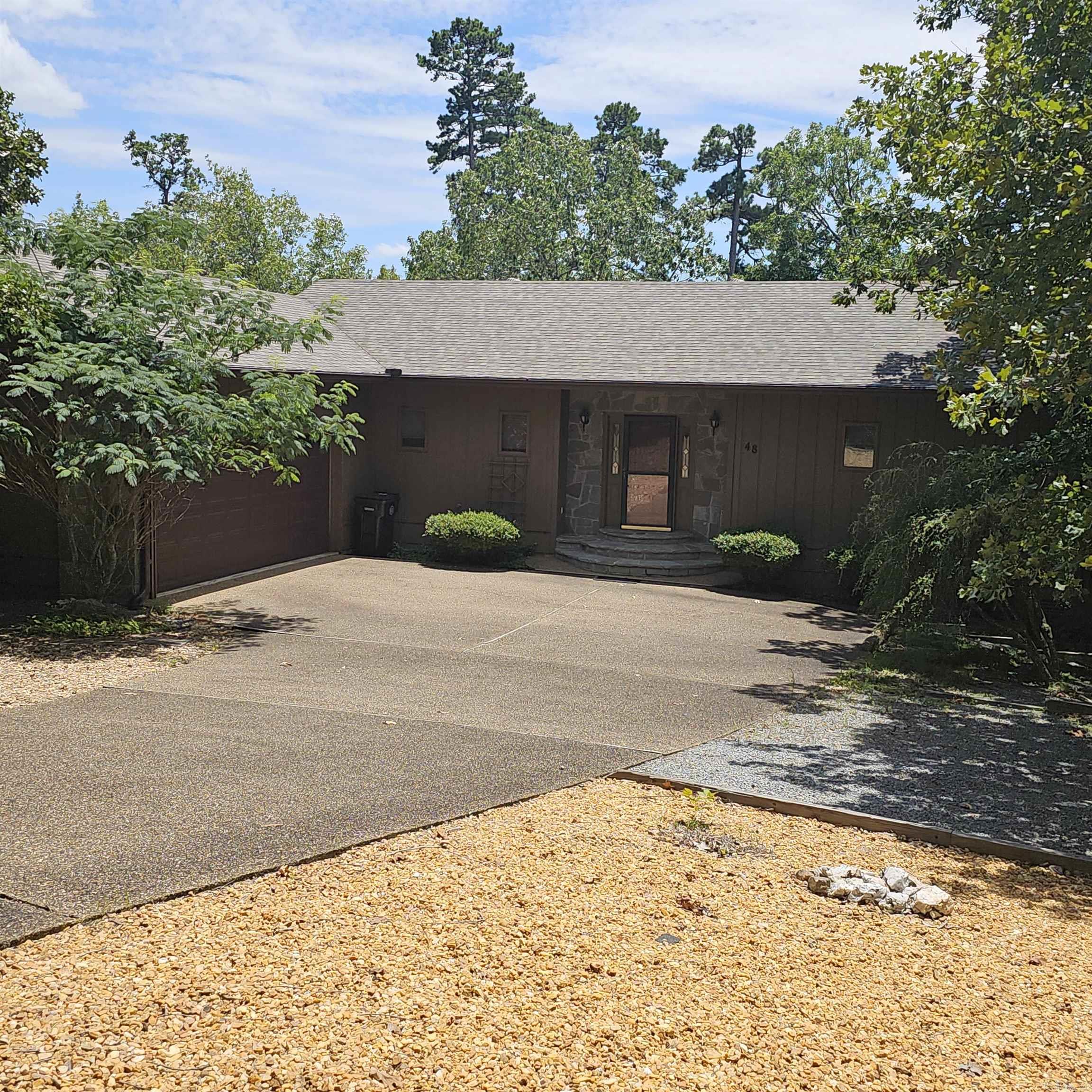 Nestled on the 4th hole of Balboa Golf Course, this 3BR, 2.5BA home (approx. 2940 h/c square feet) blends comfort and quality. Features include 9' ceilings, crown molding, lots of built-ins and 2 cozy fireplaces. Enjoy peace of mind knowing a new roof and h/a unit were done in May of 2023. Zoned heating via buried propane tank and a bonus of 487 sq. ft. of workshop. The layout provides main level convenience including the primary bedroom suite, while the guests enjoy privacy in the lower level with family room/game room, two bedrooms (one with a fireplace) and full bath. Unwind in the screen porch with golf views or sit on the covered deck spying on mother nature. A true blend of comfort, craftmanship and location at an affordable price of $389,000. Owners are offering an additional lot if needed for family membership at no additional cost. In an Estate so there is not a Seller's Property Disclosure
