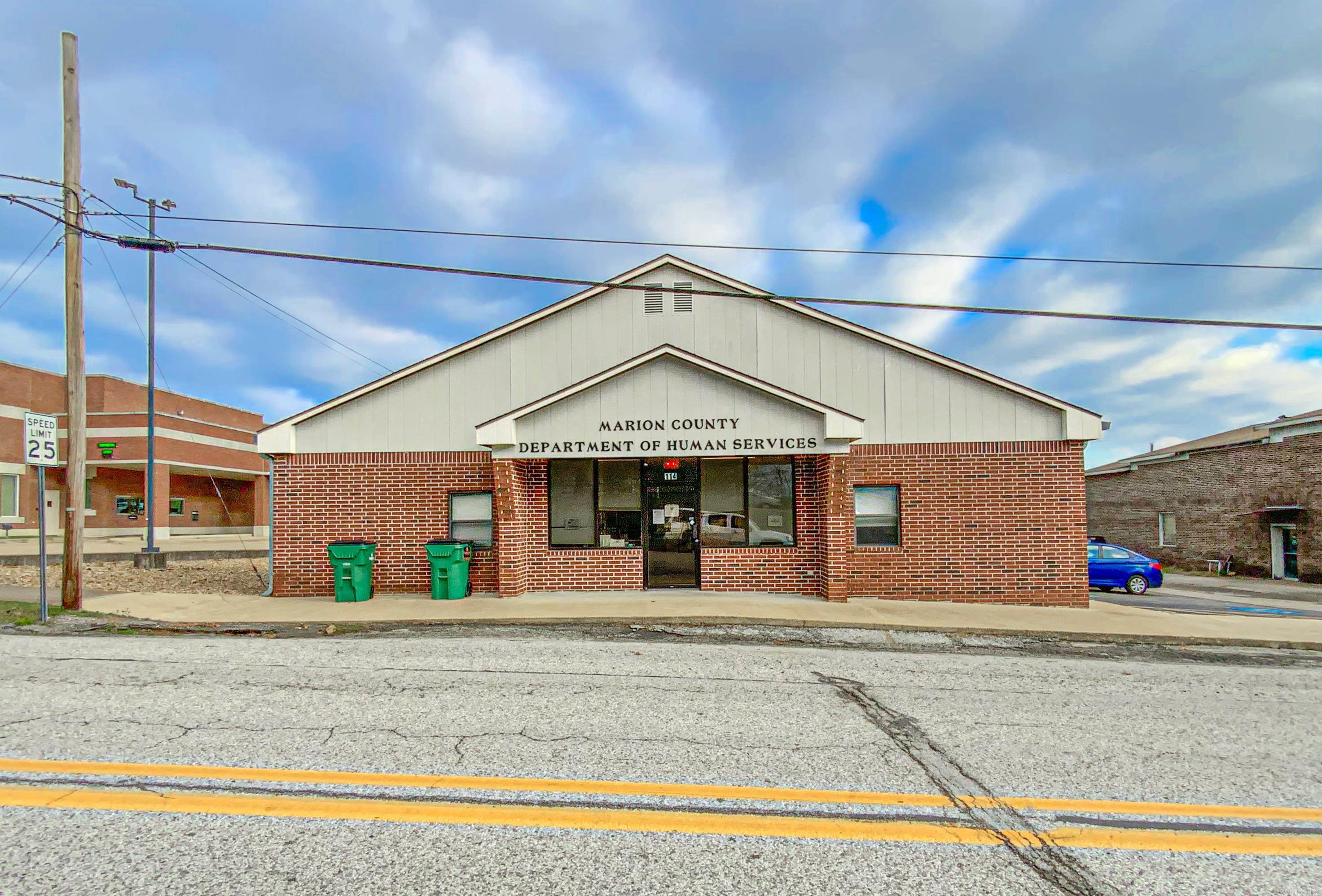 Commercial building in the heart of town. This all-brick building is in the county seat and has 15 private offices along with a waiting room, large reception office area and meeting room with kitchen. Both public and private restrooms and a storage room. This would be a perfect investment opportunity for someone to continue with the current renters. A newer roof and currently being freshly painted inside. Just over 4,000 sq ft of space with many possibilities.