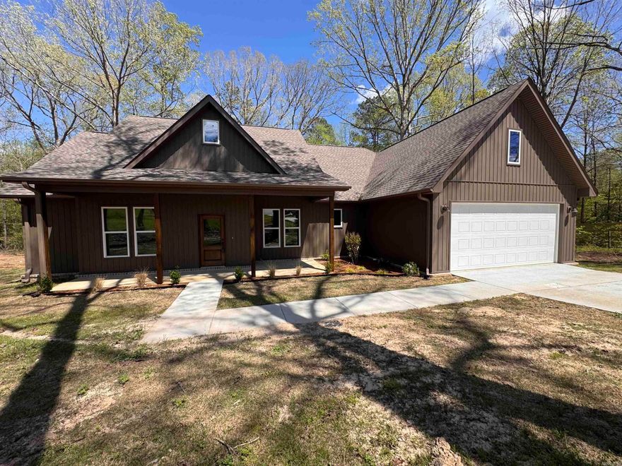 **New Construction Gem in Pear Orchard Subdivision**  Welcome to your new home in the desirable Pear Orchard Subdivision, where modern elegance meets thoughtful design. This stunning new construction offers everything you’re looking for in comfortable and stylish living.   As you step inside, you’ll be greeted by an open and inviting atmosphere, highlighted by the expansive living room with its impressive 10-foot ceilings. Enjoy the warmth and charm of the gas fireplace, creating a perfect ambiance for cozy gatherings and relaxation. The home’s layout seamlessly combines functionality and comfort, ideal for both day-to-day living and entertaining guests.  The heart of this home is the well-appointed kitchen, featuring modern natural gas appliances. Whether you’re hosting a dinner party or preparing a meal for family, you’ll appreciate the convenience and efficiency of the tankless hot water heater, ensuring hot water is always available when you need it.  With four generously-sized bedrooms, there’s plenty of space for everyone. Each bedroom is thoughtfully designed with walk-in closets, providing ample storage and organization options.