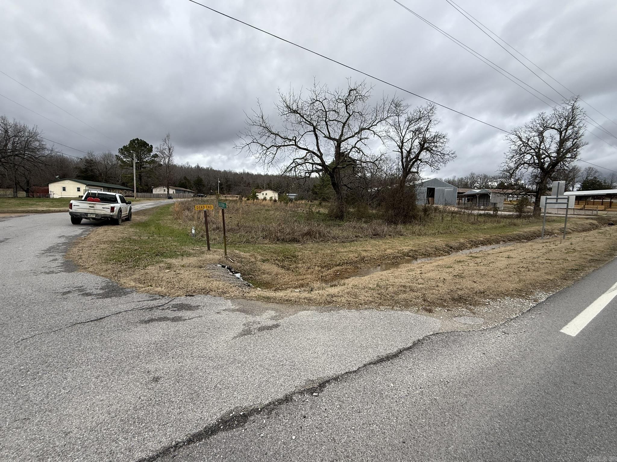 Residential or Commercial Opportunity – Franklin, AR Discover the potential of lots 1 and 2 in the Franklin subdivision, offering an approximate 0.88 acres combined. This versatile property is suitable for residential or commercial use.  It is perfectly situated across the road from B and B Supply and has highway frontage for maximum visibility. Utilities, including water and power, are available, making this an easy and convenient location to develop. This is an incredible opportunity to build your dream home, establish a business, or invest in a high-visibility location. Don’t miss out on this Franklin, Arkansas gem! Listed for only $39,900!
