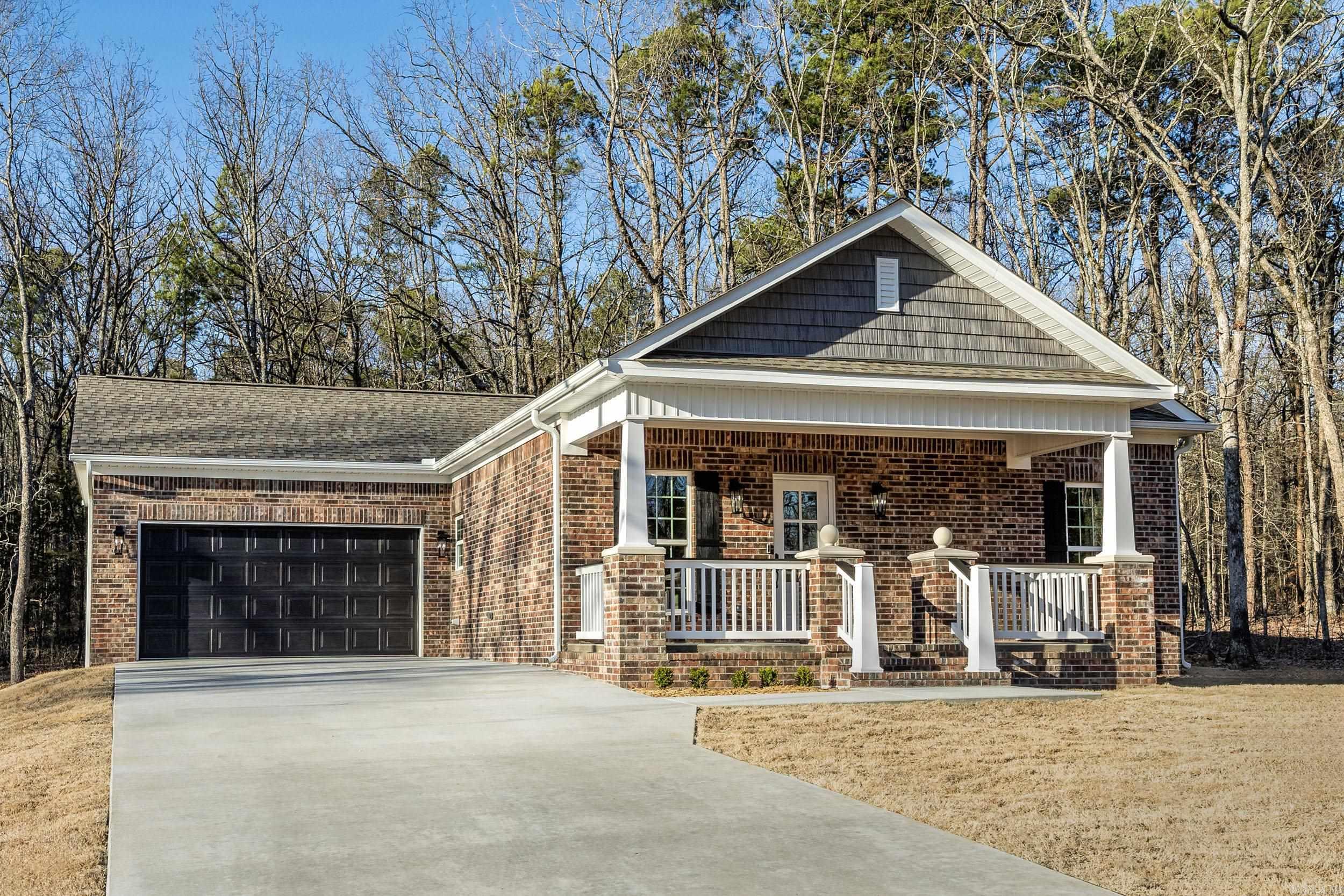 With an accepted offer seller will either pay buyer's closing cost up to but not to exceed $5000 or will pay for a 2-1 rate buy down. Nestled in the heart of a golfing and boating haven, this property offers breathtaking views of the natural landscape teeming with wildlife from almost every room. Located in the prestigious Fairfield Bay Resort, you'll enjoy world-class amenities, including two award-winning golf courses, the pristine waters of Greers Ferry Lake, 90 miles of UTV trails, seven swimming pools, and numerous hiking adventures. Home Features: 3 bedrooms, 2 full baths Open-concept great room with kitchen and living areas Gourmet kitchen with granite countertops, dining and bar seating Range included. Walk-in closets, Barnwood Lifetime Warranty Flooring, and ceiling fans for comfort Smart design with automatic night light receptacles and USB-C outlets for rapid phone charging. Concrete back porch with ceiling fans. Exterior Highlights: Lot backs up to serene wooded greenspace Bermuda sod lawn with a smart irrigation system Double car garage and large driveway for ample parking One block from the iconic Indian Hills Golf Course