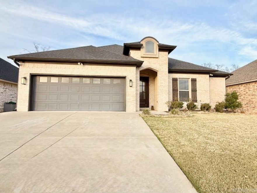 Beautifully set in Maumelle Valley Estates, this Tahoe Drive gem captures sweeping views of Pinnacle Mountain and the Chenal corridor. Inside, the home shines with fresh interior paint, new bedroom carpet, and a sleek upgraded lighting package that elevates every space.  The open, comfortable layout features a generous family room and an oversized primary suite, complemented by walk-in closets in every bedroom. A spacious laundry room with sink adds convenience and function.  Outdoor living is a standout with a covered patio, fireplace, and large seating area—ideal for relaxing or entertaining year-round. The fully fenced backyard offers privacy and room to enjoy  Exceptionally well-priced to deliver outstanding value in a prime Maumelle location—this home blends style, comfort, and opportunity in one remarkable offering.