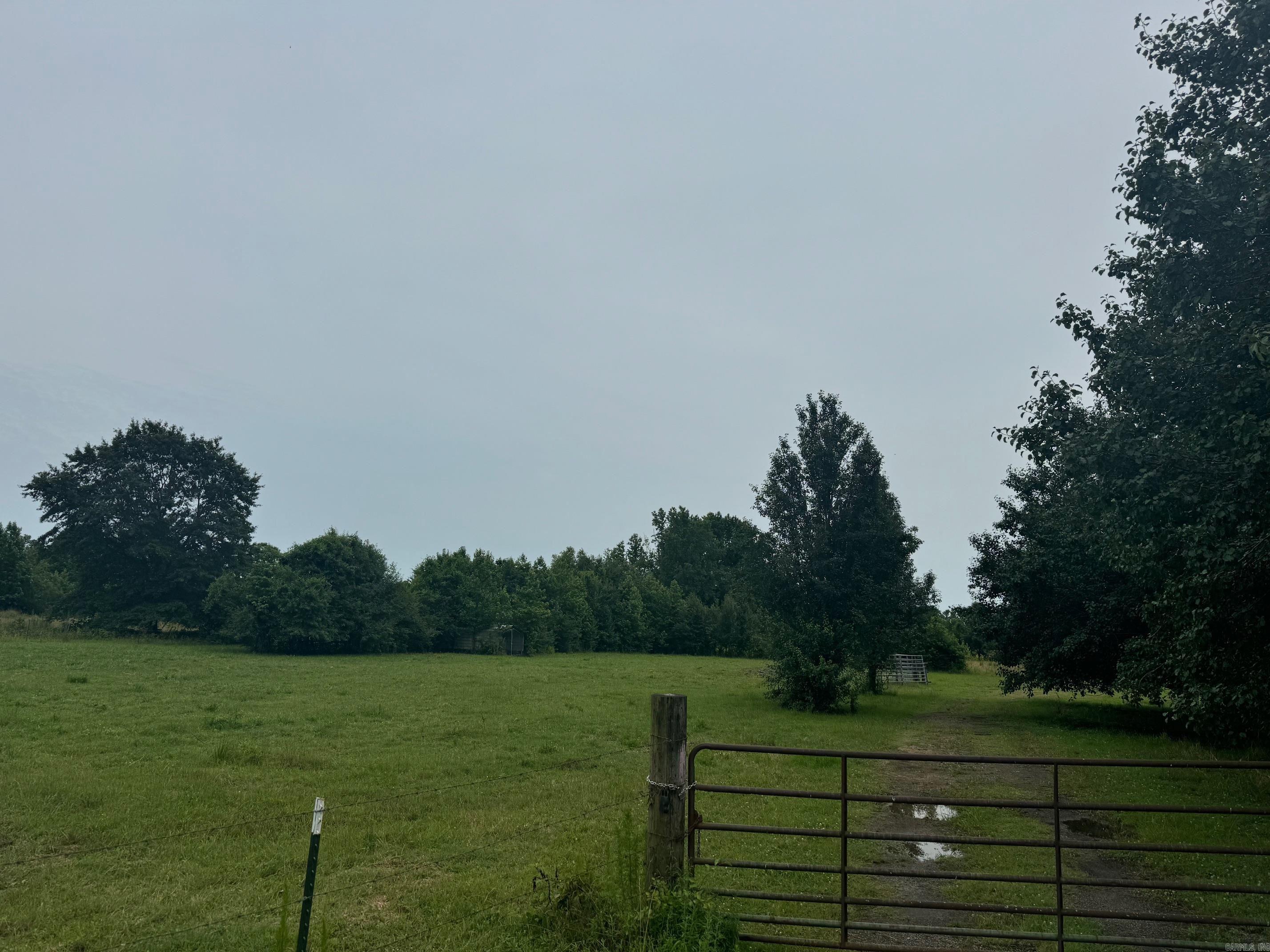 Beautiful land to build your dream home! This land is flat with trees mostly on the property lines. Fenced and gated with 3 water spigots. Grand Prairie Water and First Electric. No restrictions. Barndos welcome! This property could be a purchased to subdivide also. Great location in the Cabot school district. Not in the flood plain. Current perc test in docs. This listing is entered twice with 13.87 Ac MLS 25016188