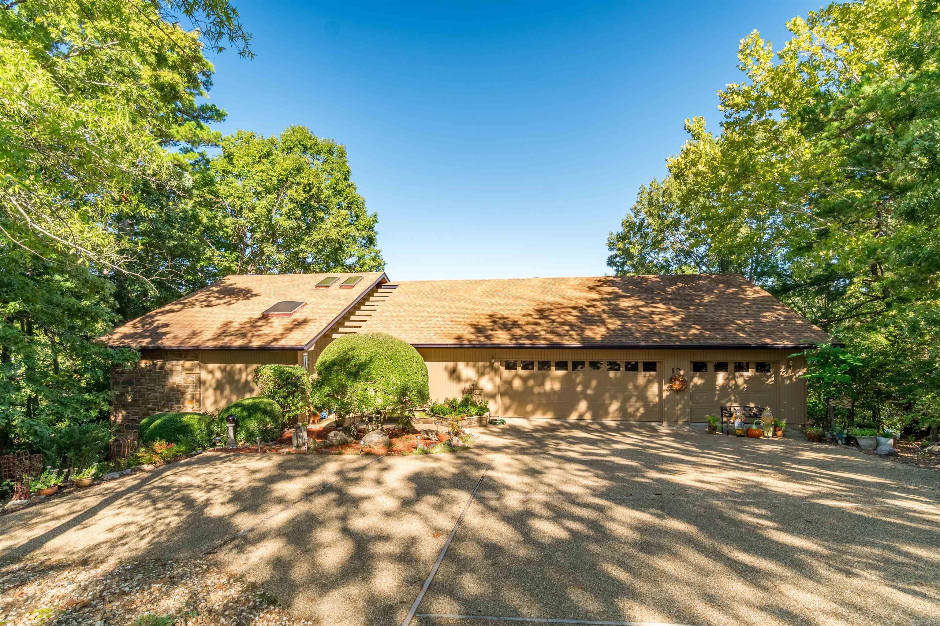 lake Balboa home with a great view! Also, with a floorplan you will enjoy -- Divided bedrooms. Great room has wood burning fireplace -- could be converted to propane if wanted. Primary bedroom has large bath area with tub & shower -- His and hers closet. Large lot with gentle driveway, Three car garage; front covered atrium (beautiful plant & seating area). Large deck in the back with lake views. No dock, but lake frontage allows for one. Well maintained property; roof replaced in 2017 - Check it out! SEE AGENT REMARKS