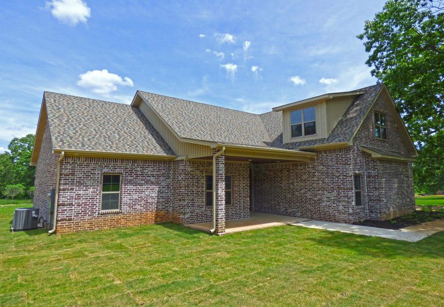 Come home to this beautiful custom-built house featuring 4 bedrooms, 3 baths, spacious living room with built-in bookcases, gas fireplace and vaulted ceilings, custom gourmet kitchen with exquisite cabinetry and granite countertops and walk-in pantry.  Tile flooring runs throughout the downstairs and carpet upstairs.  Three of the four bedrooms are on the main floor including a separate large master suite. The main floor also includes a laundry room, safe room and flex room off the front entry that could function as an office/study/formal dining room.  Custom details like trey ceilings in all of the bedrooms and large walk-in closets add to the quality of this move-in-ready home.  Upstairs has a spacious family room with large windows providing lots of natural light, plus a bedroom and full bath.  The home boasts a brick exterior with a 2-car garage (including extra length for larger vehicles), covered back porch with wonderful views of the surrounding rolling landscape.  This location with 1.75 acres will feel like you are truly living the country life but with all the conveniences of being close to nearby schools, churches and commercial businesses.