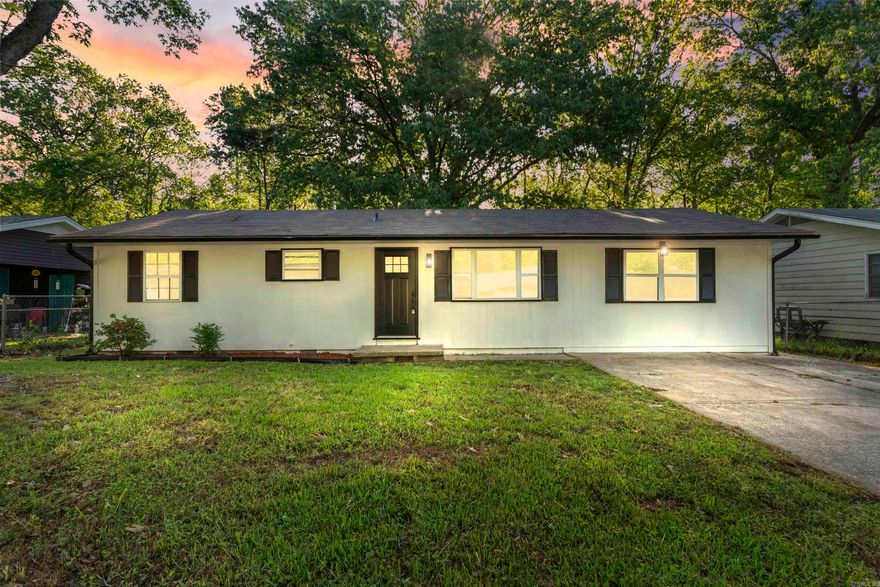 Beautifully remodeled home for under $200k on a tree-lined street in Benton! This home has great curb appeal with modern white exterior paint, black shutters and updated light fixtures. Fully fenced exterior. Inside, you'll find all new luxury vinyl flooring throughout the home, granite countertops in the kitchen, and new paint throughout. Two living areas in this home with the traditional living room along with a large bonus room just off the kitchen that features a bar area. 3 bed/1 bath. Large shade tree in both the back and front yard. Storage building in back yard conveys with the property. Patio off the back. This home is move-in ready! Great location just 5 minutes to thriving downtown Benton, 5 minutes Benton High School, and easy access to I-30.