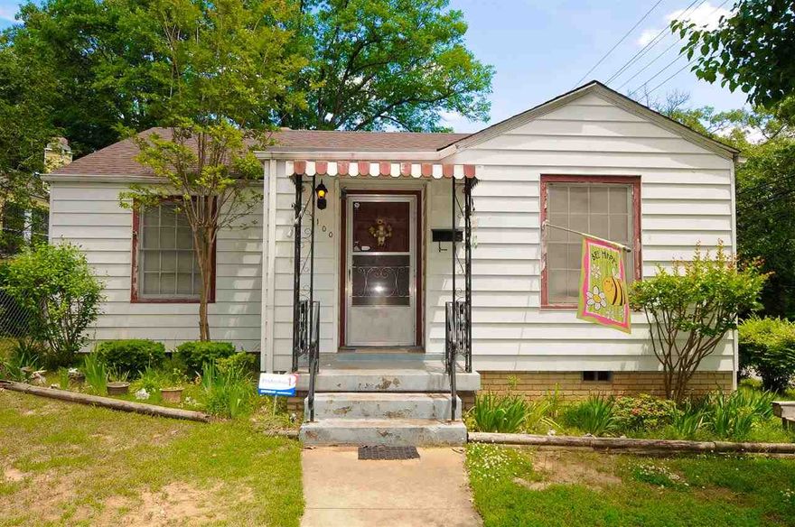 This Park Hill Cottage/Bungalow is being sold as is.  Great investor opportunity. Beautiful dark hardwood floors. Spacious formal dining with french doors and original crystal knobs.  Adorable kitchen with gas range and side exit.  Full laundry through the french doors with exit to the back.  The architectural roof is approximately 5 years old.  Storage building in the back off the garage.  Extra large patio area for cook outs.  Walking distance to the park.  Easy connect to I 40 Large corner lot.