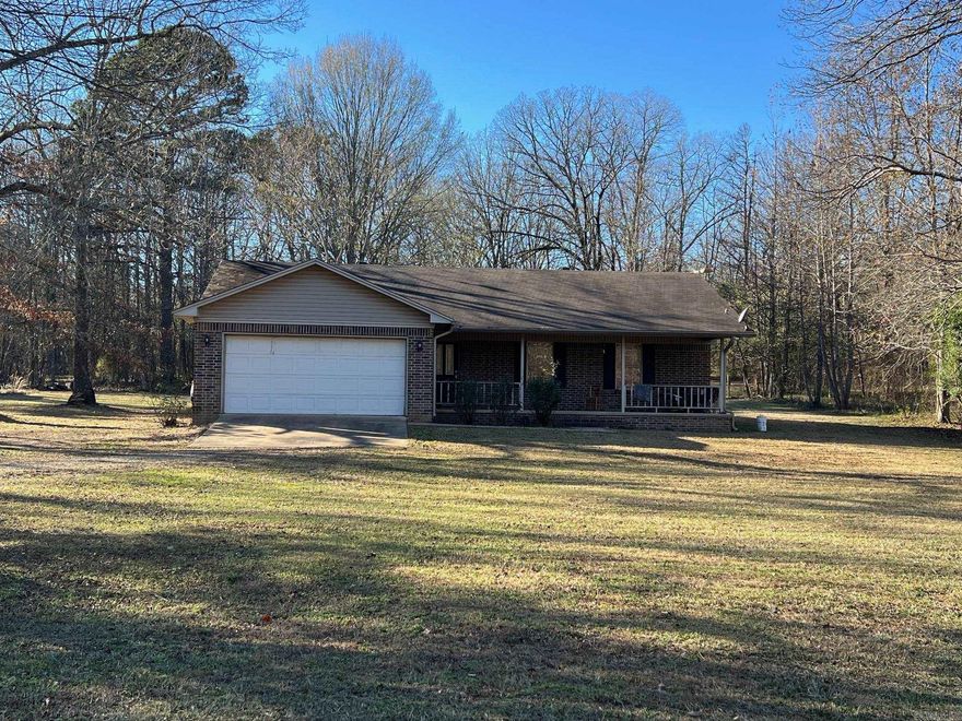 Nice Brick Three Bedroom Two bath home on two acres with two car garage. This home is ready for a new family.  Nice private quiet location just south of town.