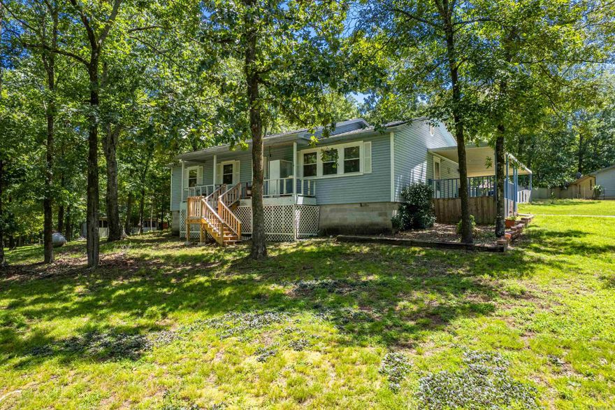 Welcome to 121 Newark Circle—your perfect slice of country living on 2 beautiful acres! This charming 3 bed, 2 bath home features a brand-new roof (July 2025) and offers peaceful views where you can watch deer from your front yard. Enjoy mornings on the covered front porch or evenings on the side porch. The kitchen boasts all stainless steel appliances, and the washer and dryer stay too! A large shop with a new garage door adds extra storage or workspace. The entire property is fenced with a powered gate for added privacy and convenience. Don’t miss this rare blend of comfort, function, and quiet country charm.